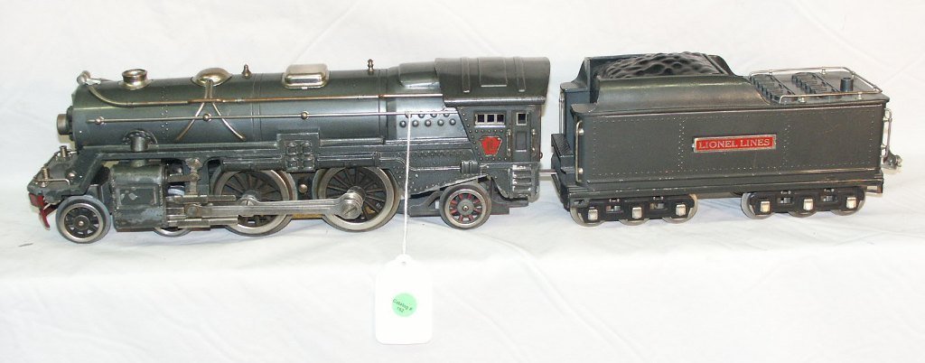 LIONEL PRE-WAR STANDARD GAUGE 392E GUN METAL WI: LIONEL PRE-WAR STANDARD GAUGE 392E GUN METAL WITH GRAY NICKEL TRIM ENGINE - 392W NO WHISTLE, GUN METAL AND GRAY NICKEL TRIM TENDER SMALL CORROSION AND PAINT LOSS.