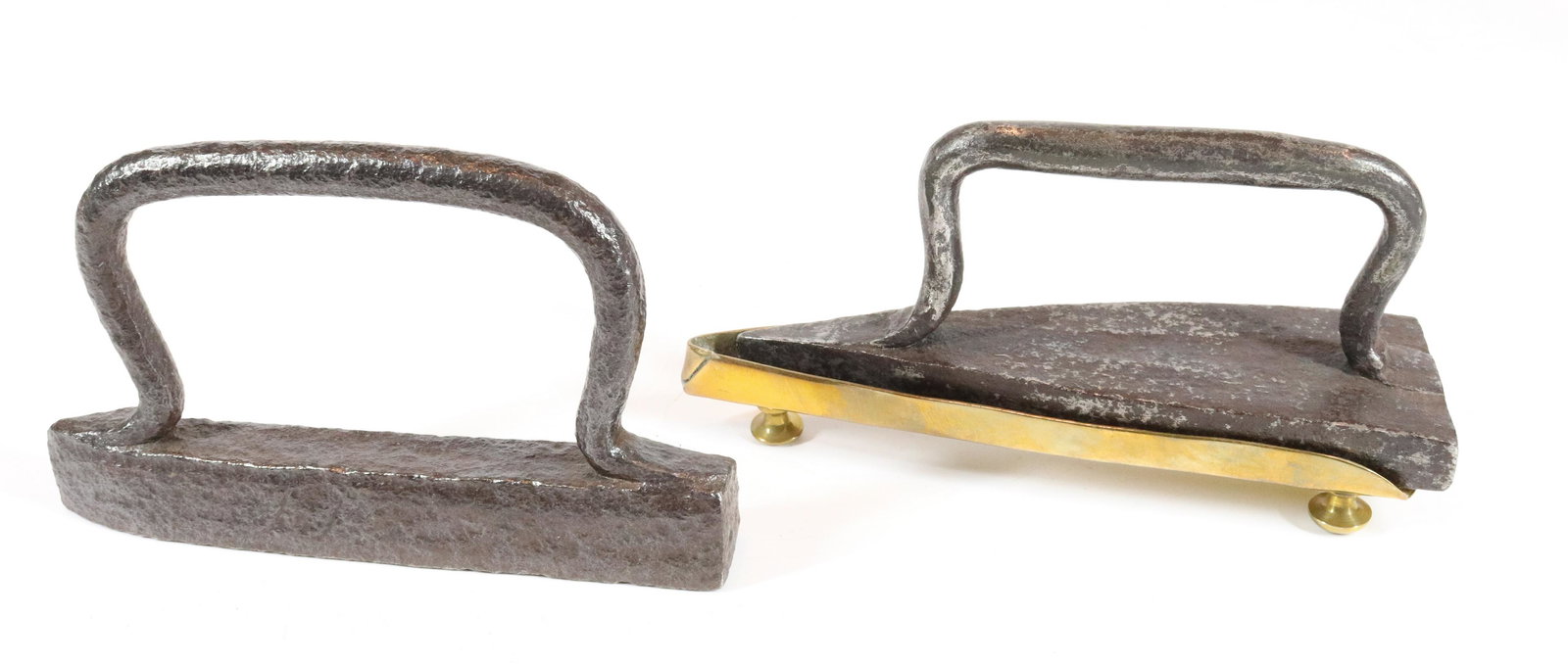 (2) BLACKSMITH MADE IRONS: (2) INCLUDING - SLEEVE IRON WITH BRASS TRIVET AND HAND FORGED GERMAN SEAM IRON - 7" L UPDATED 2023 TERMS FOR PURCHASING AND SHIPPING OF AUCTION ITEMS. PLEASE READ CAREFULLY BEFORE BIDDING. ALL PAYMENT