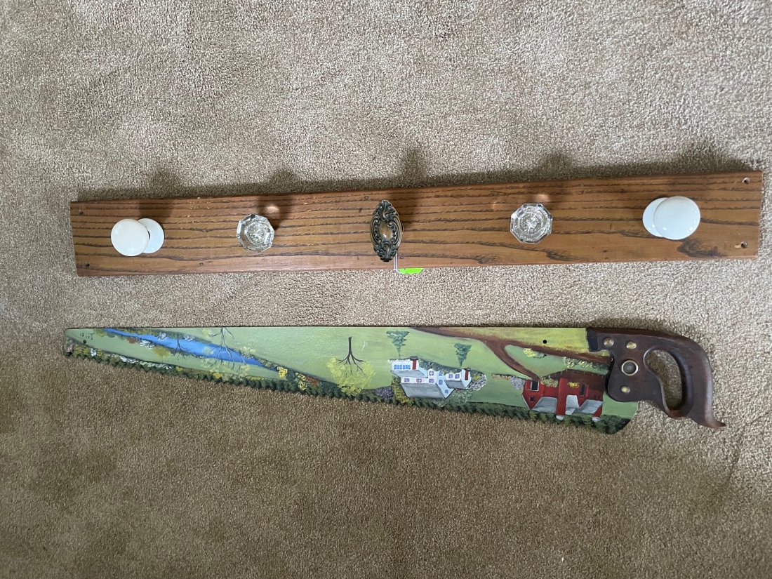 HAND PAINTED SAW AND DOOR KNOBS: 40" SAW SIGNED LEE 1984 AND FIVE ANTIQUE DOOR KNOBS MOUNTED ON OAK BOARD UPDATED 2023 Terms for Purchasing and Shipping of Auction Items. Please read carefully before bidding. All payments for purchas