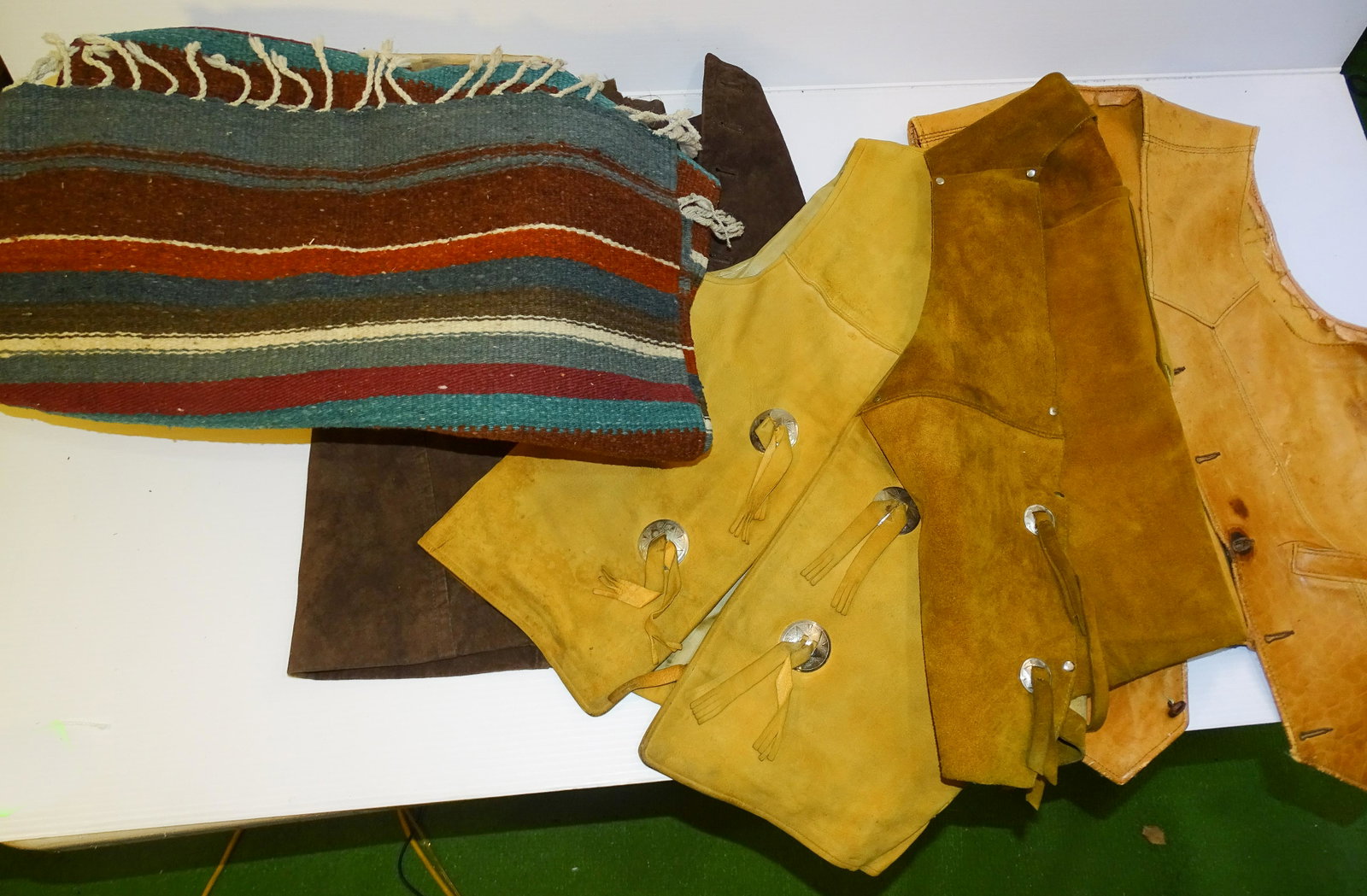 LEATHER VESTS AND BLANKETS: THREE VESTS AND NATIVE AMERICAN RUG UPDATED 2023 Terms for Purchasing and Shipping of Auction Items. Please read carefully before bidding. All payments for purchases will be made through LiveAuctionee