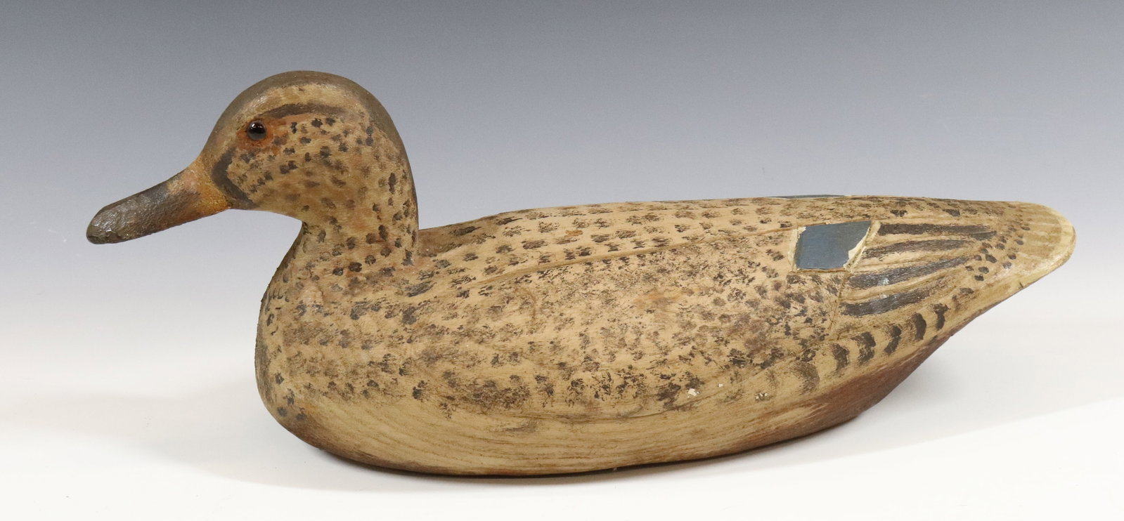 WOODEN DUCK DECOY: HAND CARVED AND PAINTED WITH GLASS EYES. UNMARKED. 14" L. PLEASE READ CAREFULLY - Terms for Purchasing and Shipping of Auction Items. Please read carefully before bidding. All payments for purchases w