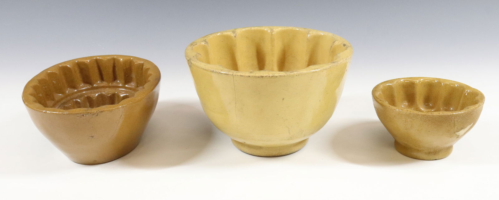 (3) YELLOW WARE FOOD MOLDS (1 of 4)