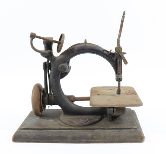 WILLCOX & GIBBS SEWING MACHINE: CAST IRON MACHINE ATTACHED TO WOODEN BASE. AS-FOUND CONDITION FOR PARTS OR RESTORATION. MACHINE IS 10 1/4" AND BASE IS 12". PLEASE READ CAREFULLY - Terms for Purchasing and Shipping of Auction