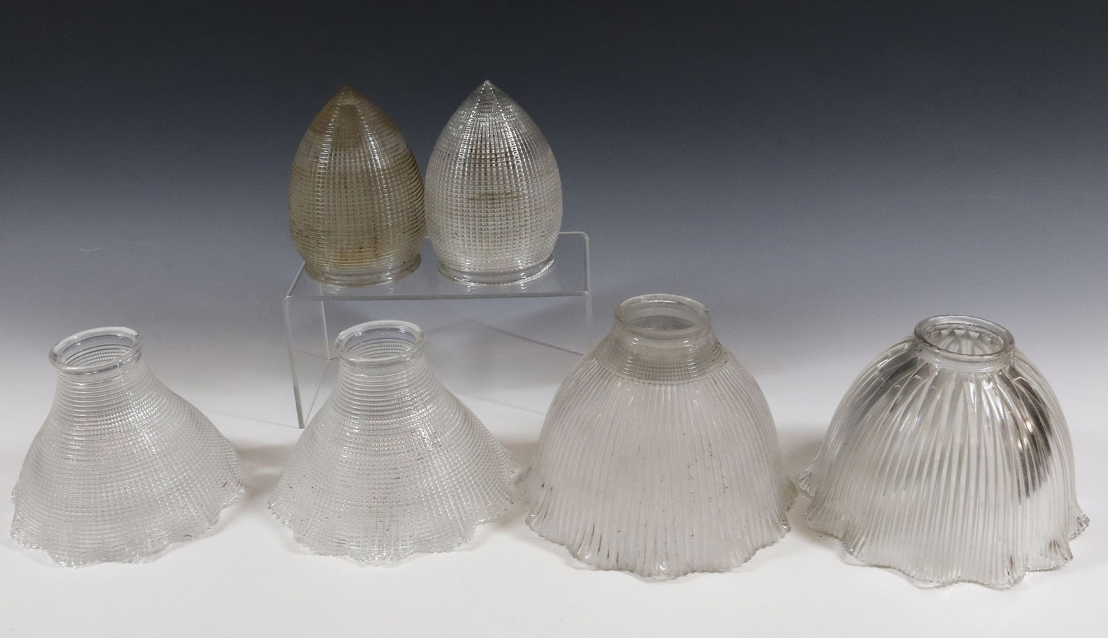 LOT OF HOLOPHANE SHADES: INCLUDING: TWO ACORN SHAPED 5" H X 3 1/8", TWO CONICAL RUFFLED 4 3/8" X 6" X 2 1/4" FITTER, ONE FROSTED RUFFLED 5" X 7" X 2 1/4" FITTER AND CLEAR RUFFLED 4 1/2" x 7" x 2 1/4" FITTER. PLEASE READ CAREF
