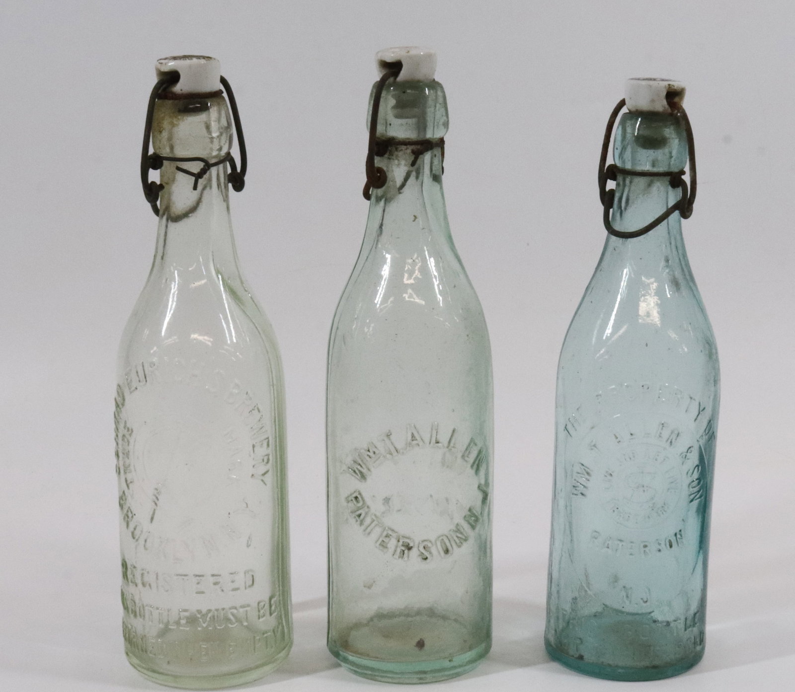 (3) PORCELAIN TOP BEER BOTTLES (1 of 4)