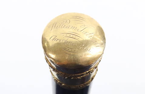 GENTLEMAN'S GOLD TOP WALKING STICK: EBONY SHAFT WITH INSCRIPTION ON GOLD TOP. "WILLIAM TATTNALL, CHRISTMAS 1866". 35" L. TOP IS UNMARKED BUT APPEARS TO BE GOLD. PLEASE READ CAREFULLY - Terms for Purchasing and Shipping of Auction Items.