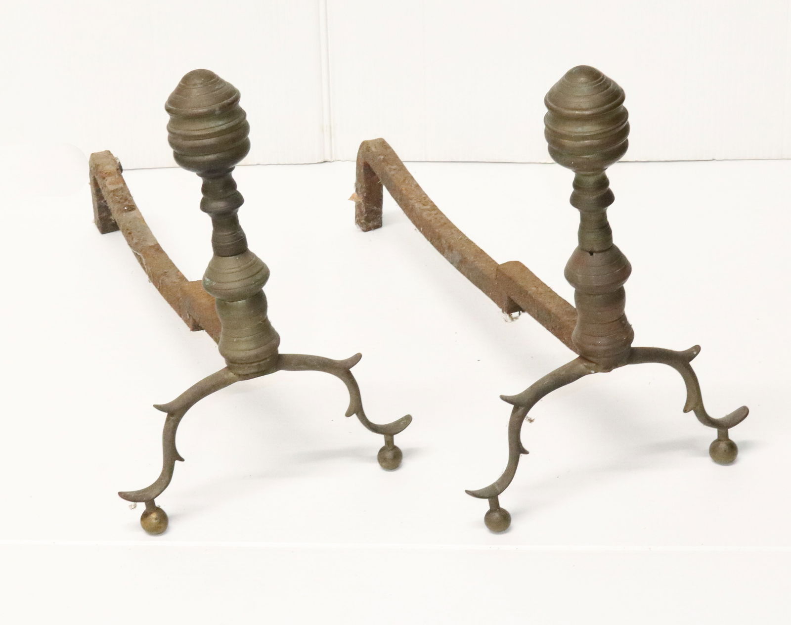 PAIR OF BRASS ANDIRONS: ANTIQUE BRASS WITH BALL FEET. 13 1/4" X 9" X 17". PLEASE READ CAREFULLY - Terms for Purchasing and Shipping of Auction Items. Please read carefully before bidding. All payments for purchases will be m