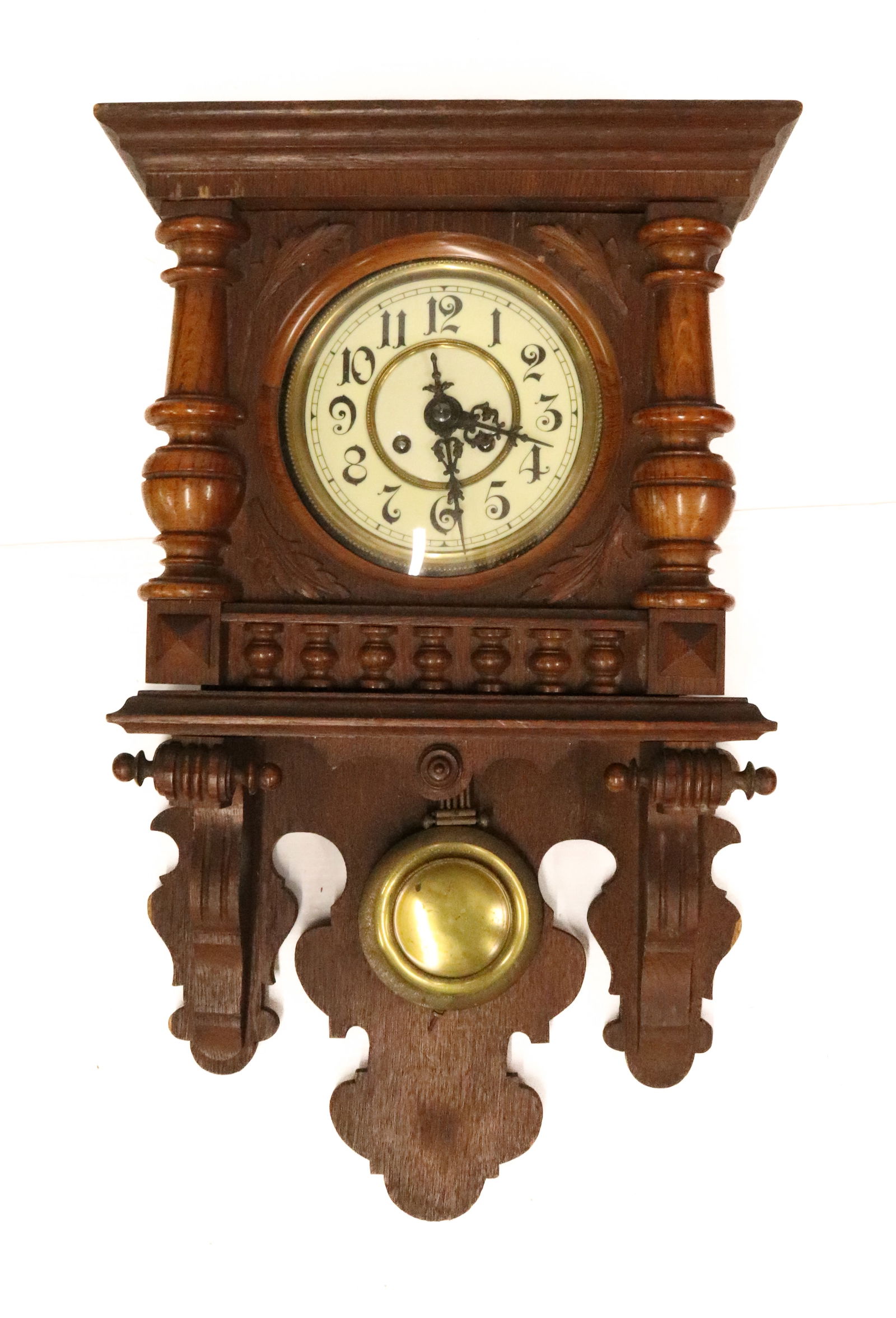 GERMAN WALL CLOCK: ENAMEL/BRASS DIAL, BRASS WORKS, CARVED CASE, BRASS PENDULUM, NO KEY. UNTESTED. 25" L. PLEASE READ CAREFULLY - Terms for Purchasing and Shipping of Auction Items. Please read carefully before bidding.
