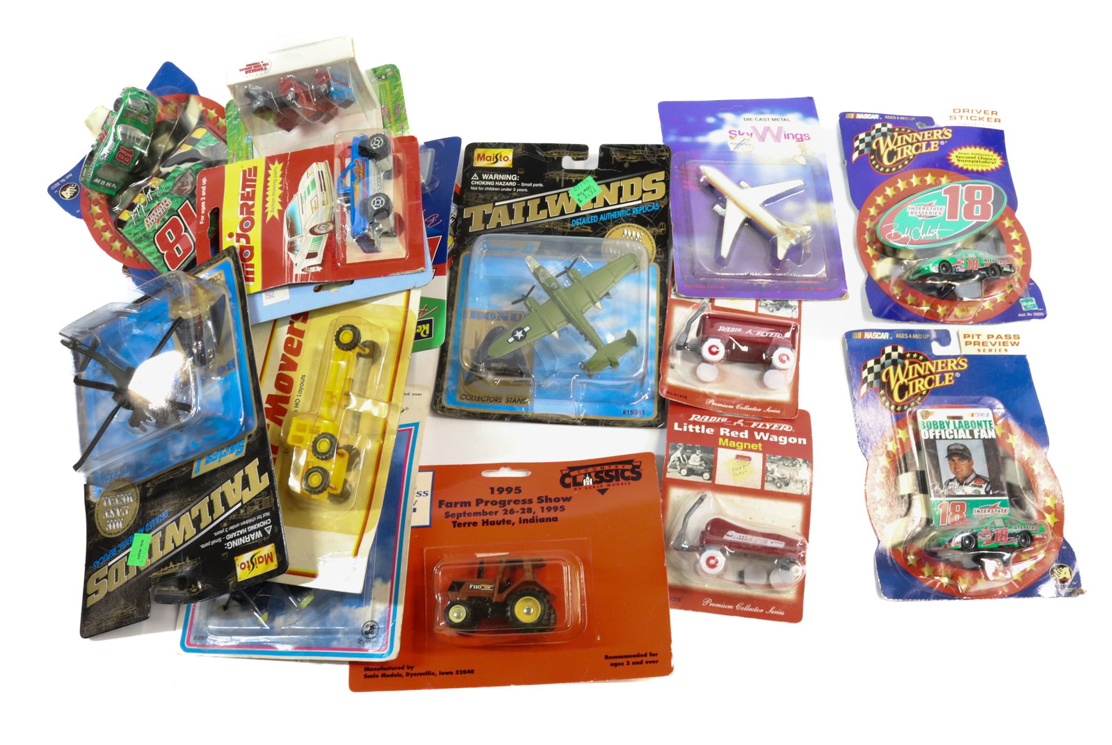 LOT OF NIB TOY CARS: (18) INCLUDING: TRACTORS, TRUCKS, AIRCRAFTS AND MORE.