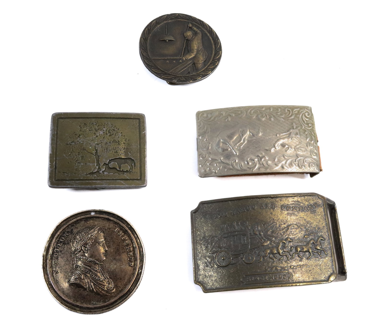 LOT OF WESTERN BELT BUCKLES: WELLS FARGO, BILLIARD PLAYER, "TWO HORSES" UNDER TREE AND MORE. LARGEST 2 1/4" X 3 1/2".