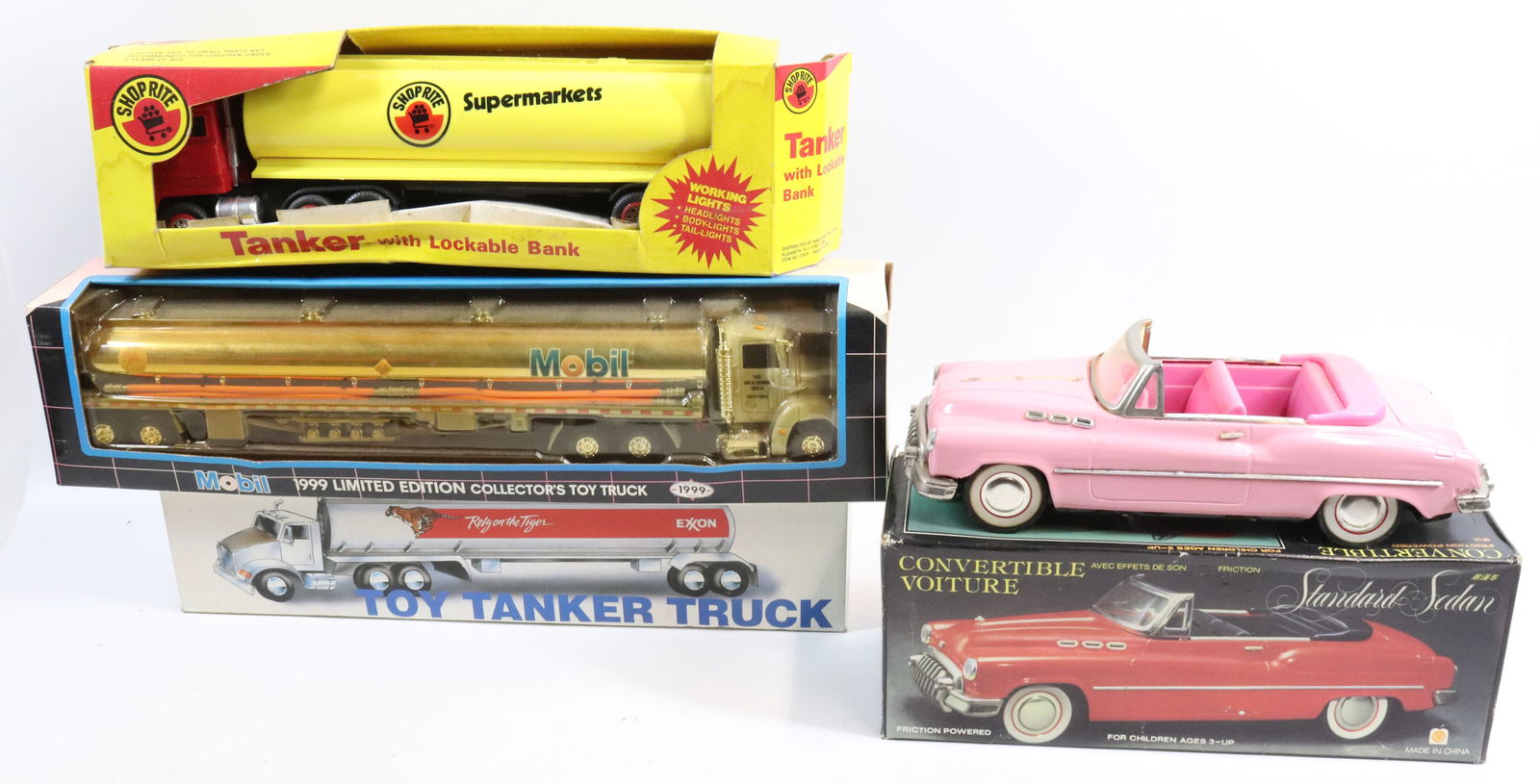 LOT OF VARIOUS TOY TRUCKS: INCLUDING: EXXON TOY TANKER, MOBIL TANKER, SHOPRITE TANKER BANK, FRICTION STANDARD SEDAN (CHINA) AND PINK FRICTION CONVERTIBLE.