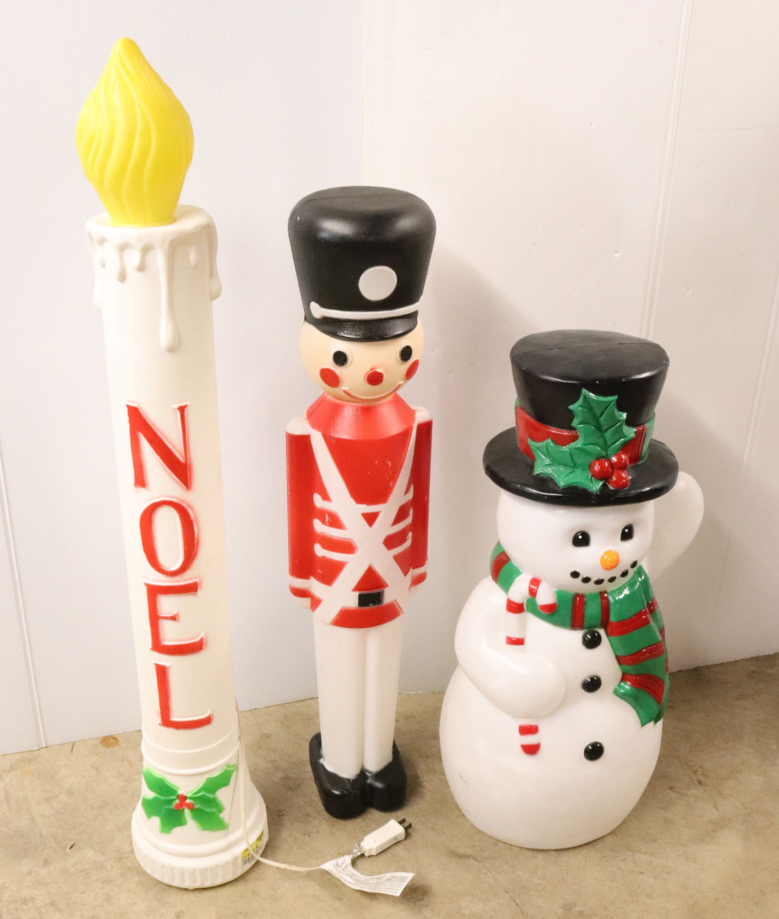 (3) CHRISTMAS BLOW MOLDS: INCLUDING: SNOWMAN, TOY SOLDIER (UNION LABEL ON BOTTOM), AND NOEL CANDLE (UNION LABEL) 36" H.