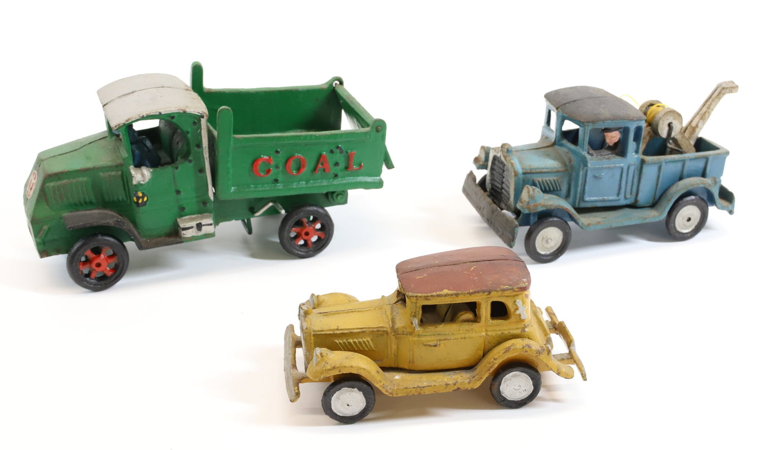 (3) CAST IRON VEHICLES: TOW TRUCK, COAL TRUCK AND YELLOW COUPE . LARGEST 8" L. Terms: PLEASE READ CAREFULLY - Terms for Purchasing and Shipping of Auction Items. Please read carefully before bidding. All payments for purchas