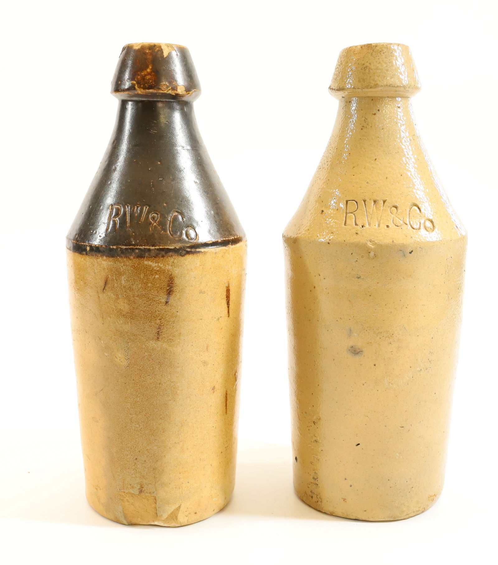 (2) STONEWARE ADVERTISING BOTTLES (1 of 6)