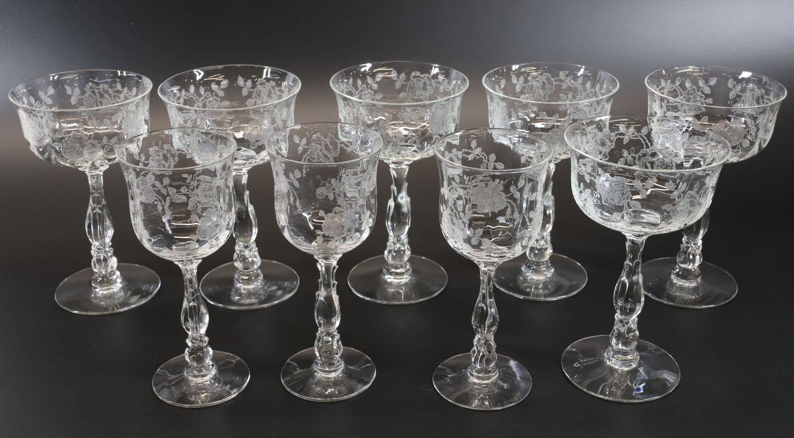 LOT OF FOSTORIA WILLOWMERE STEMWARE: (3) WINE GLASSES 5 3/4" X 2 1/2". (6) CHAMPAGNE GLASSES 5 1/2" X 3 1/4". Terms: PLEASE READ CAREFULLY - Terms for Purchasing and Shipping of Auction Items. Please read carefully before bidding. All pa