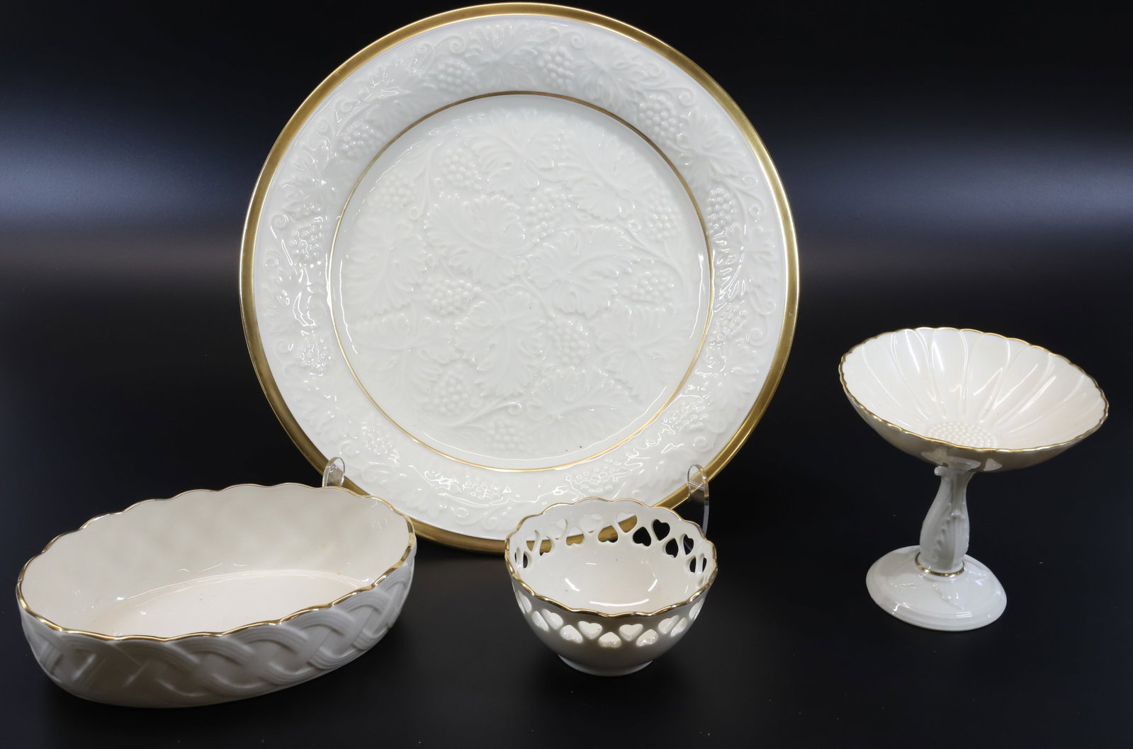 LENOX CHARGER, PEDESTAL CANDY AND TWO BOWLS: CHARGER 13" WITH GRAPEVINE PATTERN. CANDY DISH 5 1/4" H. Terms: PLEASE READ CAREFULLY - Terms for Purchasing and Shipping of Auction Items. Please read carefully before bidding. All payments for purch