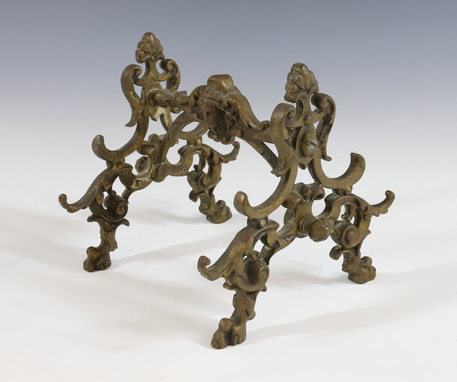 BRASS VICTORIAN PEN HOLDER: ORNATE WITH FACE MOTIF ON EITHER SIDE. 4 1/2" X 5 3/4". Terms: PLEASE READ CAREFULLY BEFORE BIDDING. THIS SALE IS ONLINE AND IN-PERSON. PREVIEW WILL BE THURSDAY JANUARY 25TH FROM 9:00 AM TILL 4:00 PM 