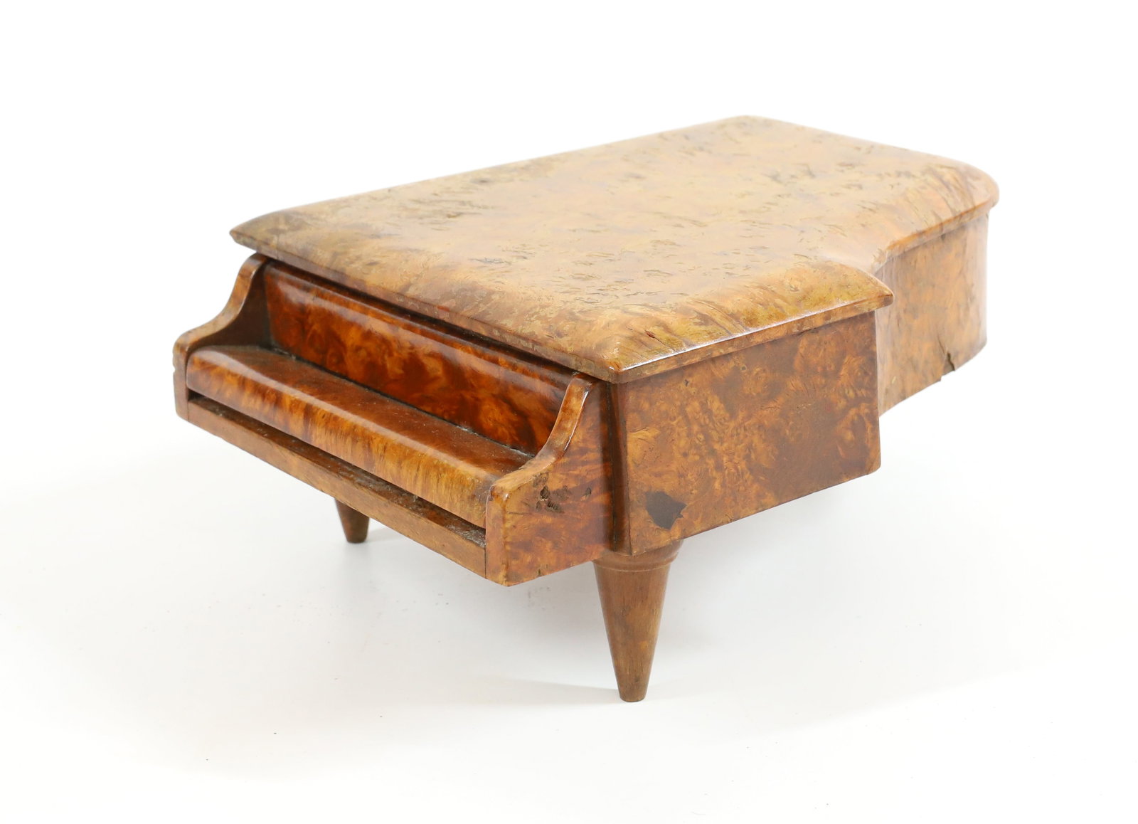 BURL WOOD PIANO MUSIC BOX: TOP LID LIFTS AND LID OVER KEYS. 7 3/4" X 6". Terms: PLEASE READ CAREFULLY BEFORE BIDDING. THIS SALE IS ONLINE AND IN-PERSON. PREVIEW WILL BE THURSDAY JANUARY 25TH FROM 9:00 AM TILL 4:00 PM AND FRIDAY