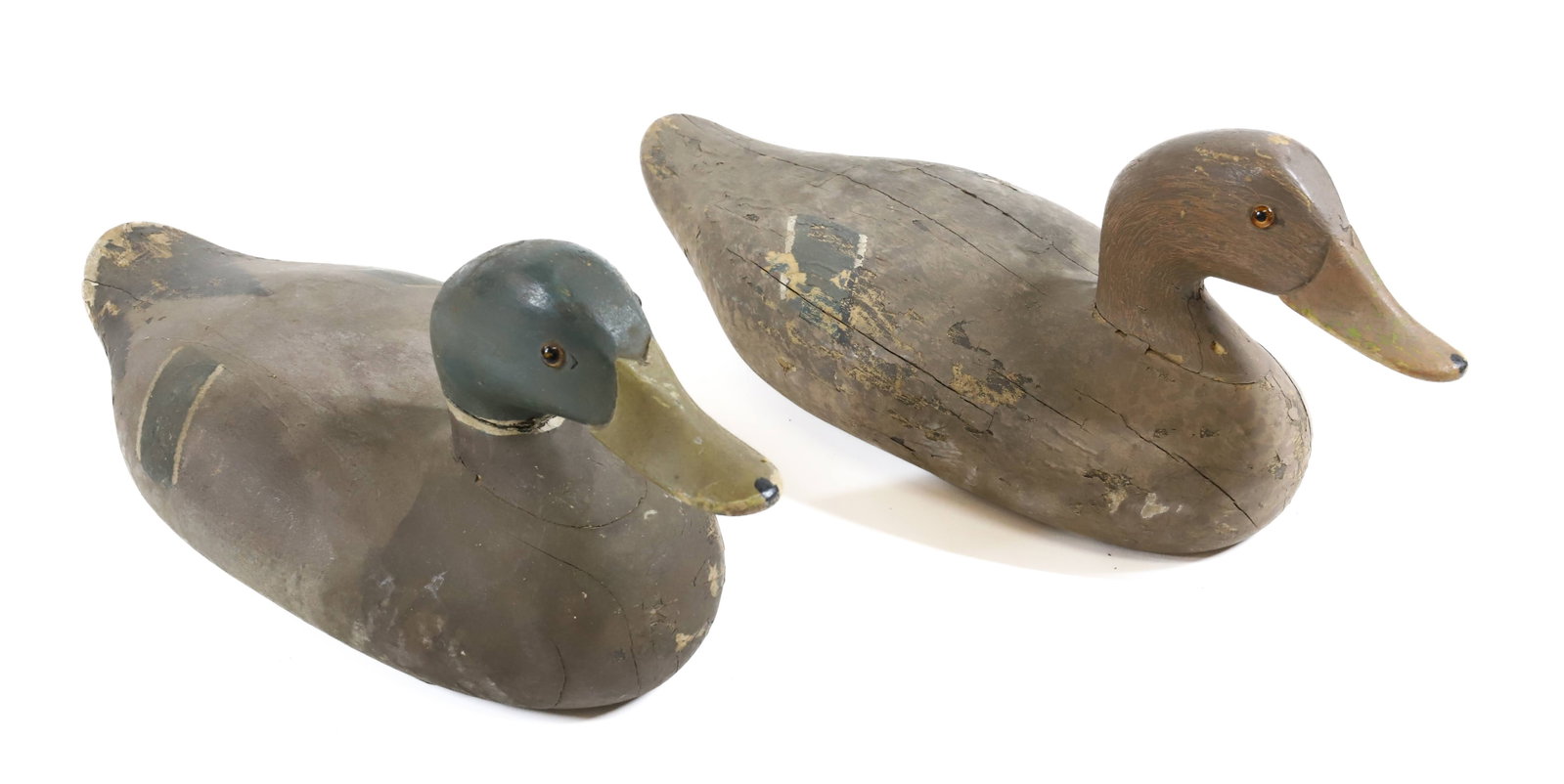 CARVED HEN AND DRAKE DUCK DECOYS: PAINTED SURFACES WITH GLASS EYES. UNMARKED. 16" L. PLEASE READ CAREFULLY - Terms for Purchasing and Shipping of Auction Items. Please read carefully before bidding. All payments for purchases will be 