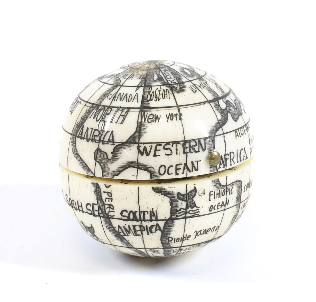 WORLD GLOBE COMPASS: CARVED BONE WITH INTERIOR COMPASS AND SUNDIAL. 1 5/8" D. PLEASE READ CAREFULLY - Terms for Purchasing and Shipping of Auction Items. Please read carefully before bidding. All payments for purchases wi