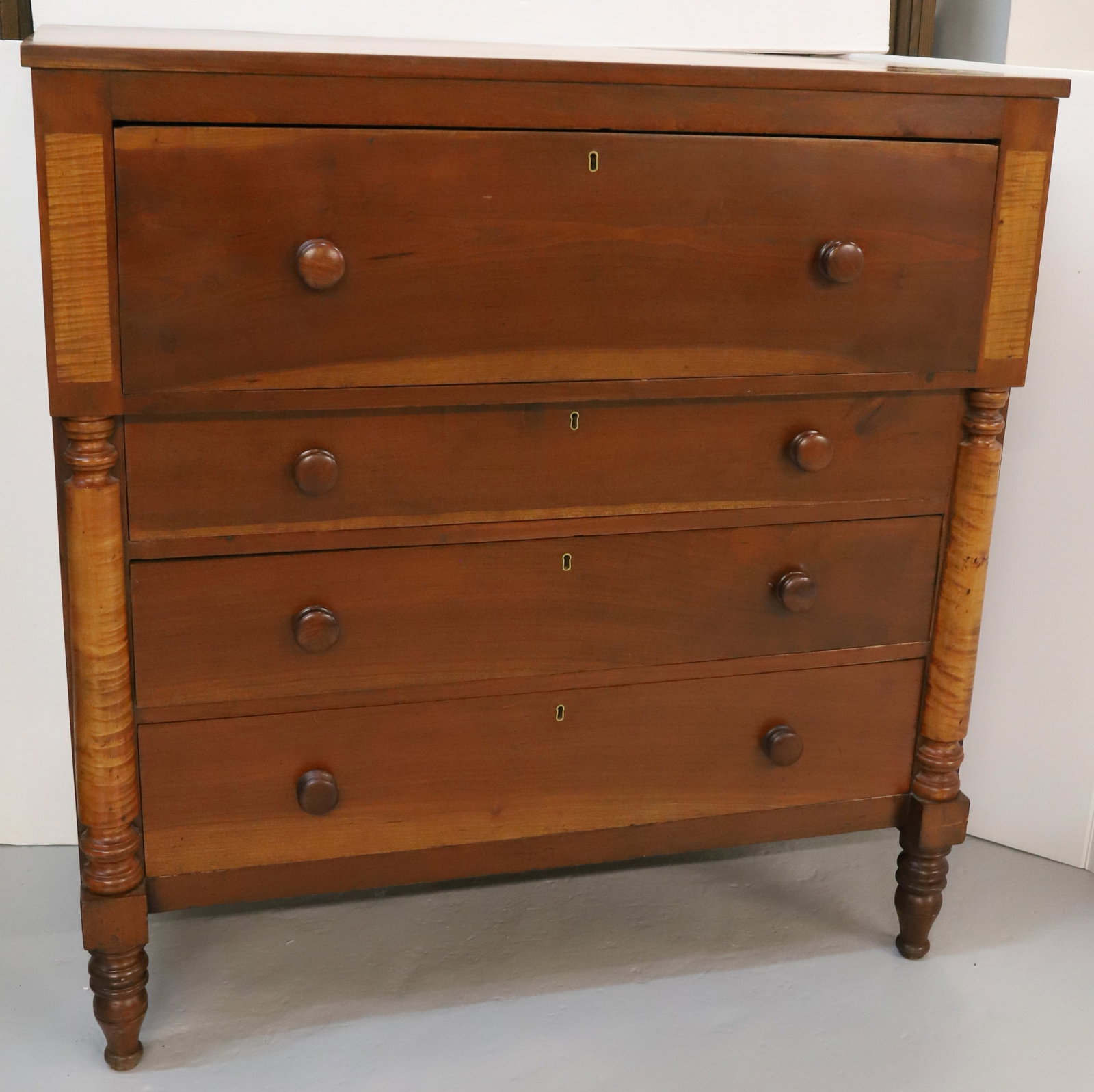 19TH C. SHERATON CHEST OF DRAWERS: LARGE DRAWER OVER THREE GRADUATED DRAWERS. PANELED ENDS. DOVETAILED CONSTRUCTION. TURNED FEET. 48" X 46" X 23". PLEASE READ CAREFULLY - Terms for Purchasing and Shipping of Auction Items. Please read 