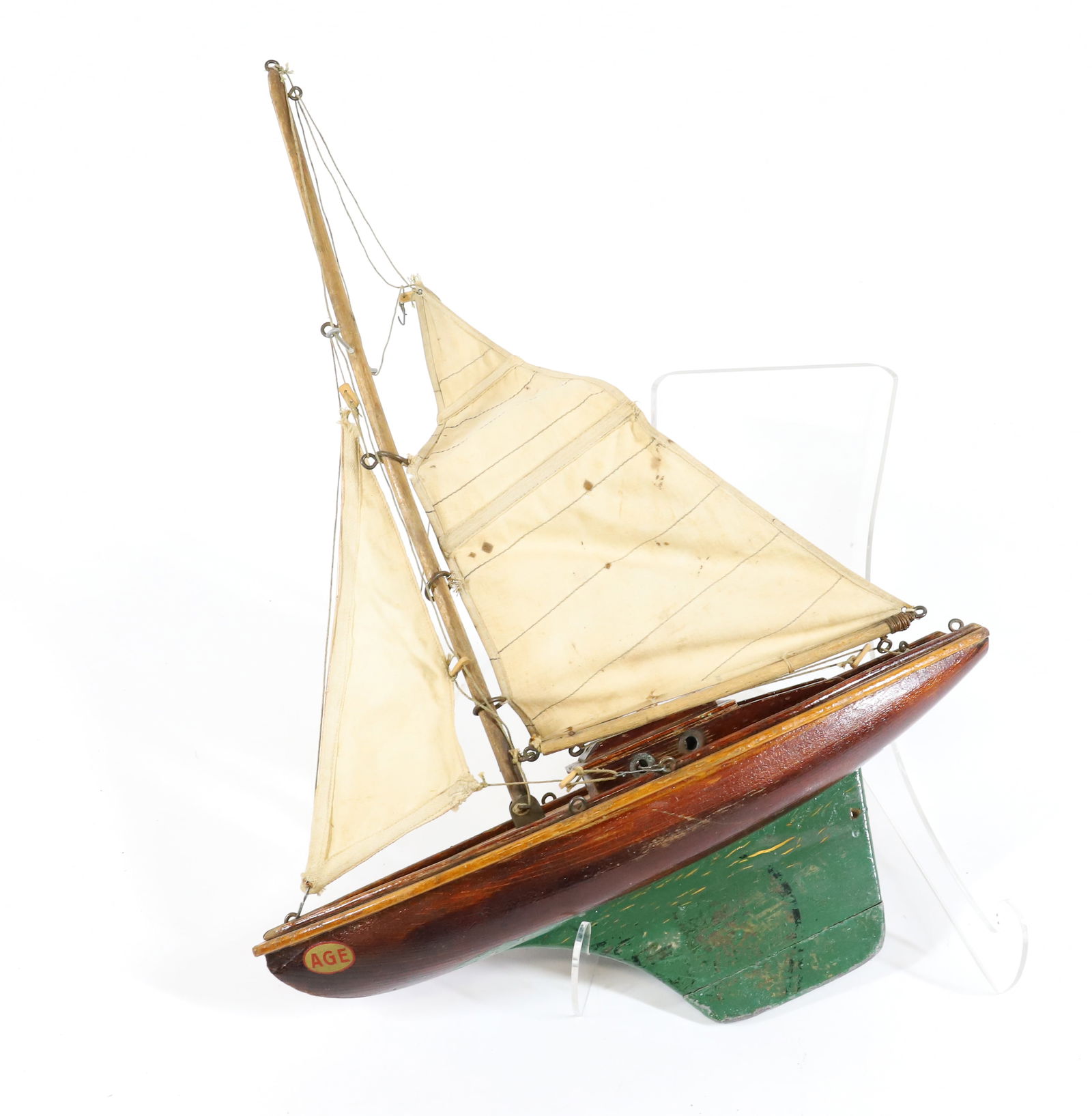 VINTAGE WOODEN POND BOAT: GREEN PAINT AND COTTON SAILS. MRKD. "AGE". 14" X 20". PLEASE READ CAREFULLY - Terms for Purchasing and Shipping of Auction Items. Please read carefully before bidding. All payments for purchases will