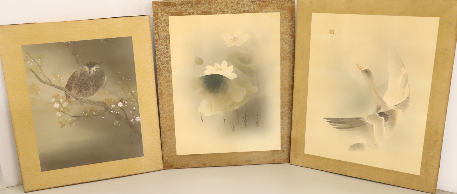 (3) JAPANESE PAINTINGS ON LINEN: OWL, LOTUS WITH BIRD AND GOOSE IN FLIGHT ALL SIGNED 26" X 22",28" X 22 1/2" PLEASE READ CAREFULLY - Terms for Purchasing and Shipping of Auction Items. Please read carefully before bidding. All paymen