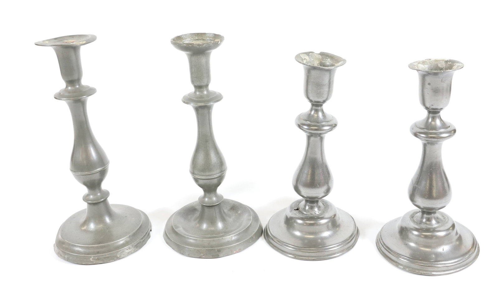 (4) PEWTER CANDLESTICKS: PUSH-UP CANDLESTICKS. 8 3/4" TO 9 3/4" H. PLEASE READ CAREFULLY - Terms for Purchasing and Shipping of Auction Items. Please read carefully before bidding. All payments for purchases will be made thro