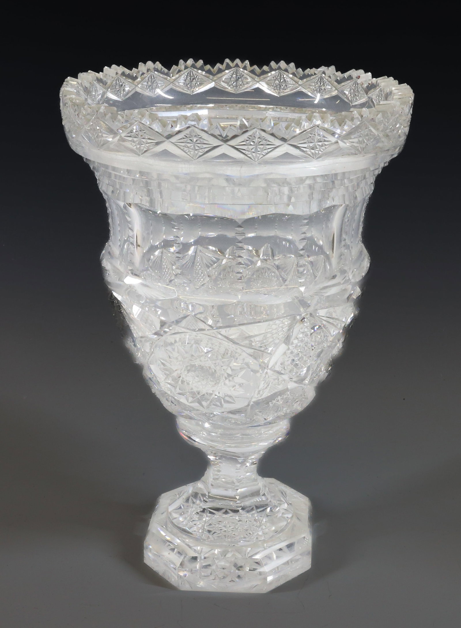 19TH C. FRENCH CUT-GLASS URN: PEDESTAL URN WITH OCTAGONAL BASE. SAWTOOTH RIM. 10 3/4" H. PLEASE READ CAREFULLY - Terms for Purchasing and Shipping of Auction Items. Please read carefully before bidding. All payments for purchases 