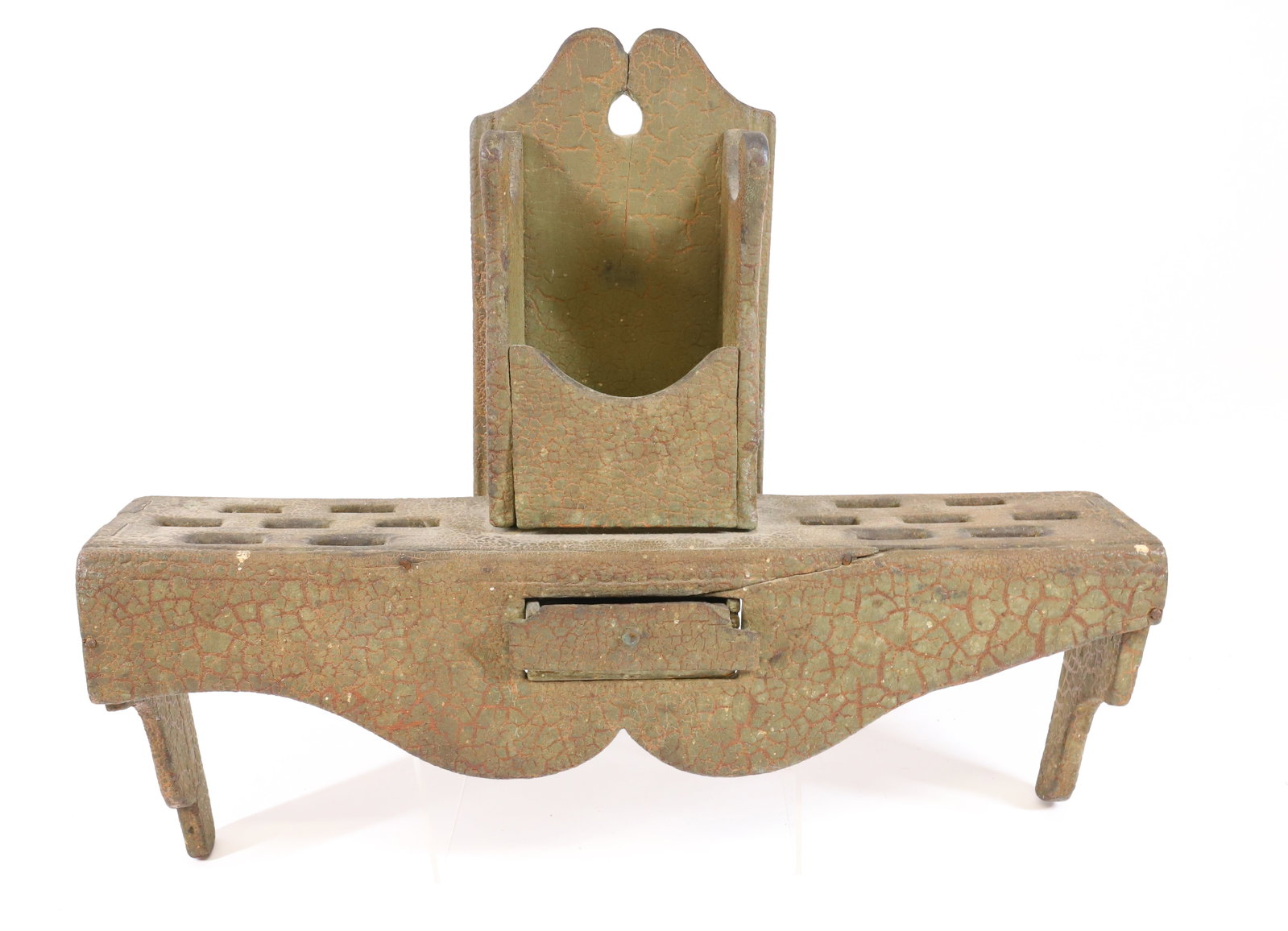 PAINTED WALL SPOON SHELF: GREEN CRACKLED PAINT OVER RED. SLOTS ON EITHER SIDE. CENTER SINGLE DRAWER. 17" X 19". PLEASE READ CAREFULLY - Terms for Purchasing and Shipping of Auction Items. Please read carefully before bidding. 