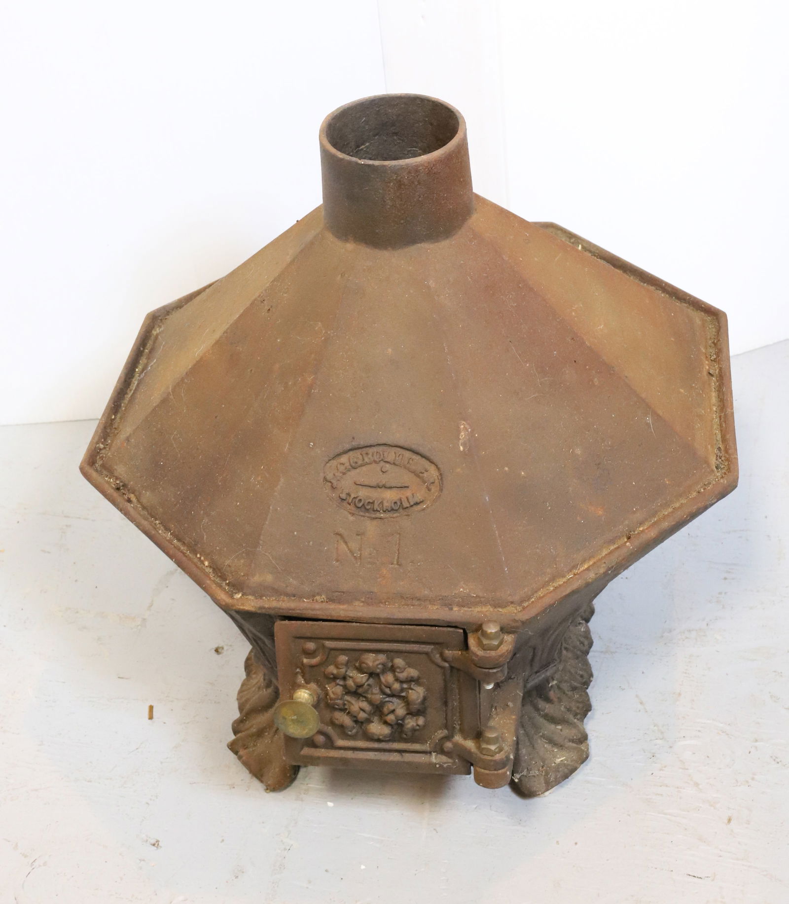 SCANDINAVIAN CAST IRON STOVE: J & C.G. BOLINDER, STOCKHOLM, NO. 1. MEASURES 15" X 15 1/2" X 15 1/2". PLEASE READ CAREFULLY - Terms for Purchasing and Shipping of Auction Items. Please read carefully before bidding. All payments fo
