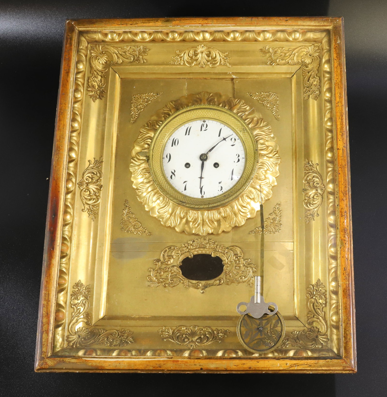 VIENNA FRAME CLOCK: ENAMELED FACE WITH GOLT WOOD TRIM, PENDULUM, AND KEY - GLASS DOOR CASE - 17" X 14" PLEASE READ CAREFULLY - Terms for Purchasing and Shipping of Auction Items. Please read carefully before bidding. All
