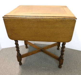 OAK DROP LEAF GAME TABLE: LIFT UP TOP, FOLDING SWIVEL TOP - TWIST LEGS, 29" X 20 1/2" X 27" (CLOSED) PLEASE READ CAREFULLY - Terms for Purchasing and Shipping of Auction Items. Please read carefully before bidding. All payment