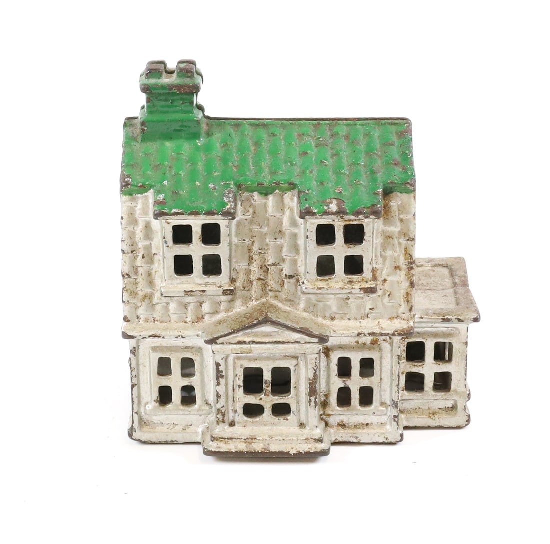 ANTIQUE CAST IRON STILL BANK: HOUSE WITH DORMER WINDOWS, SILVER PAINT, AND GREEN ROOF - 7" X 4 3/4"