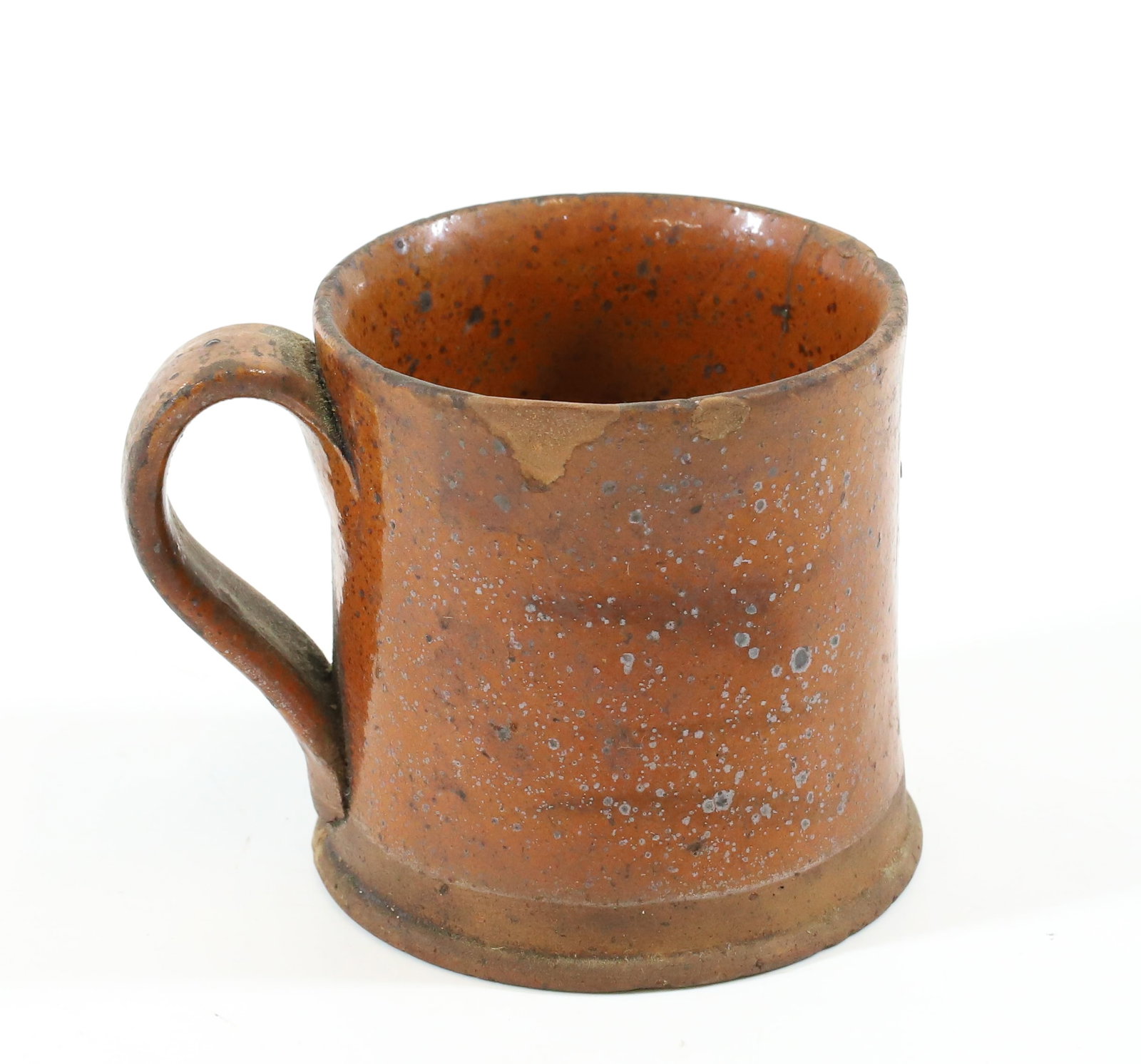 REDWARE MUG WITH APPLIED HANDLE: ORANGE WITH BROWN SPECKLES AND LINES. 2 1/2" H.