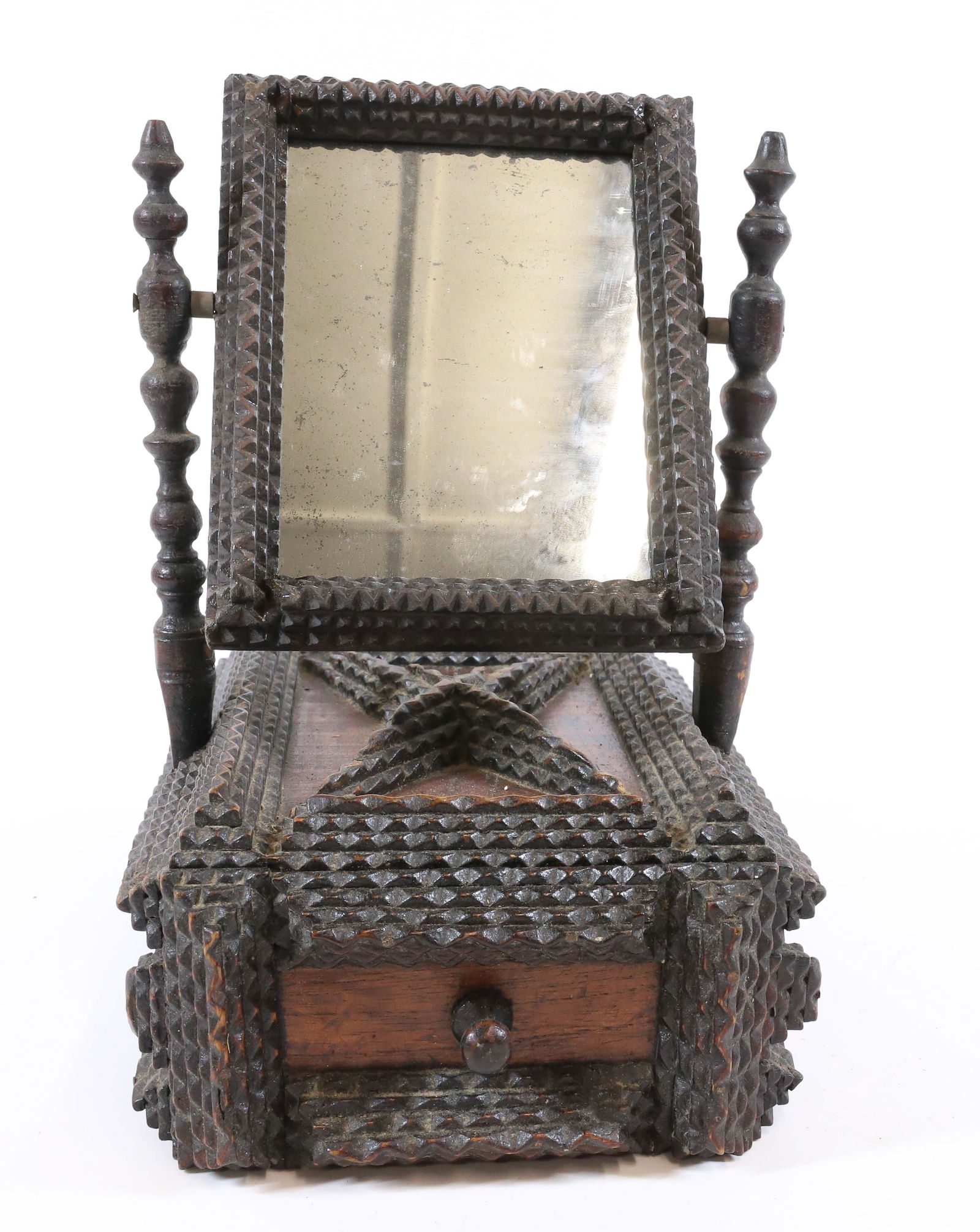 UNUSUAL TRAMP ART SHAVING MIRROR: CHIP CARVED BOX WITH SINGLE DRAWER. ATTACHED ADJUSTABLE MIRROR TO TOP. DARK FINISH. 11 3/4" X 10 1/4" X 7 3/4".