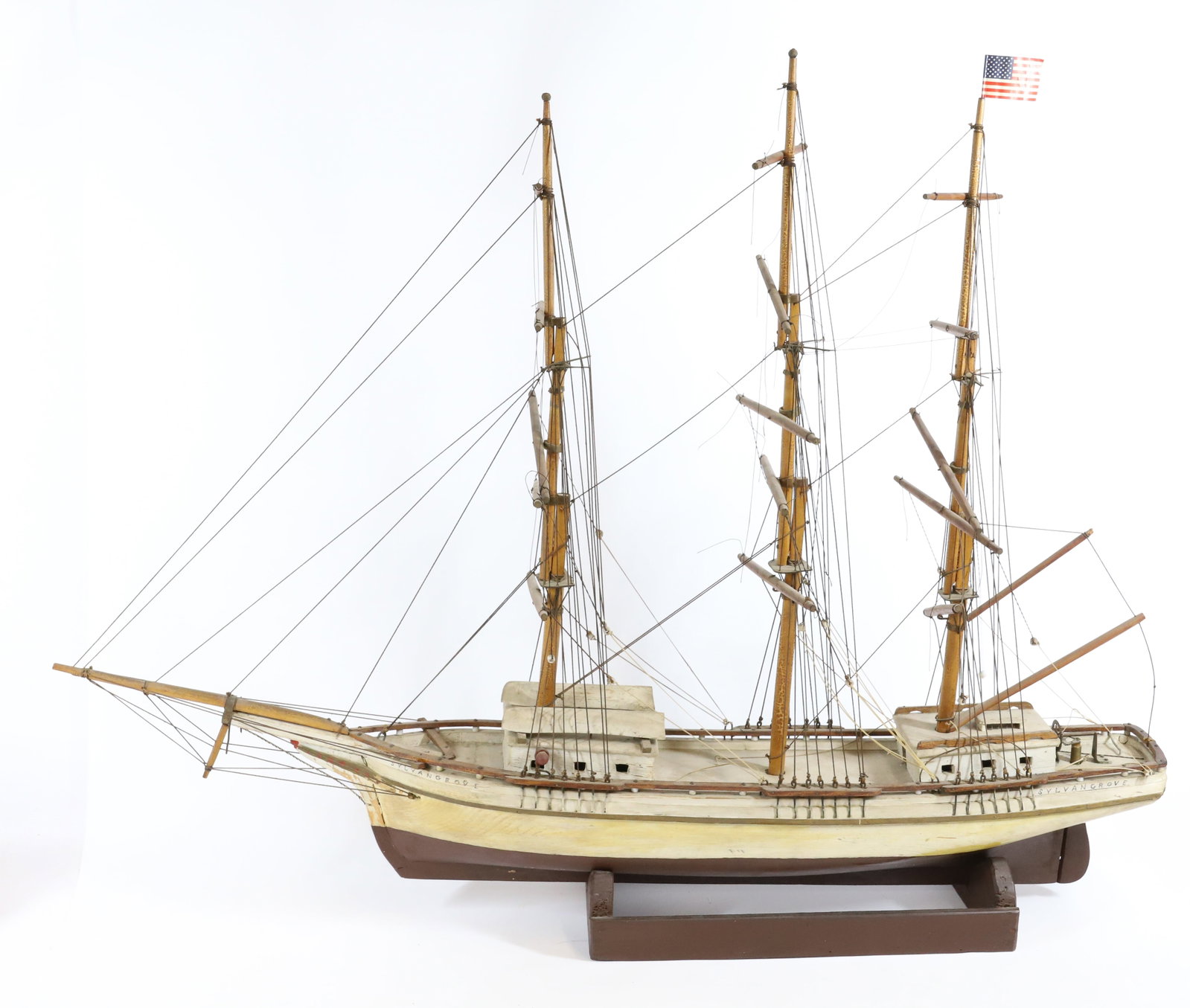 WOODEN SHIP MODEL: PAINTED WOOD THREE MAST SHIP. MRKD. "SYLVANGROVE". 38" L.
