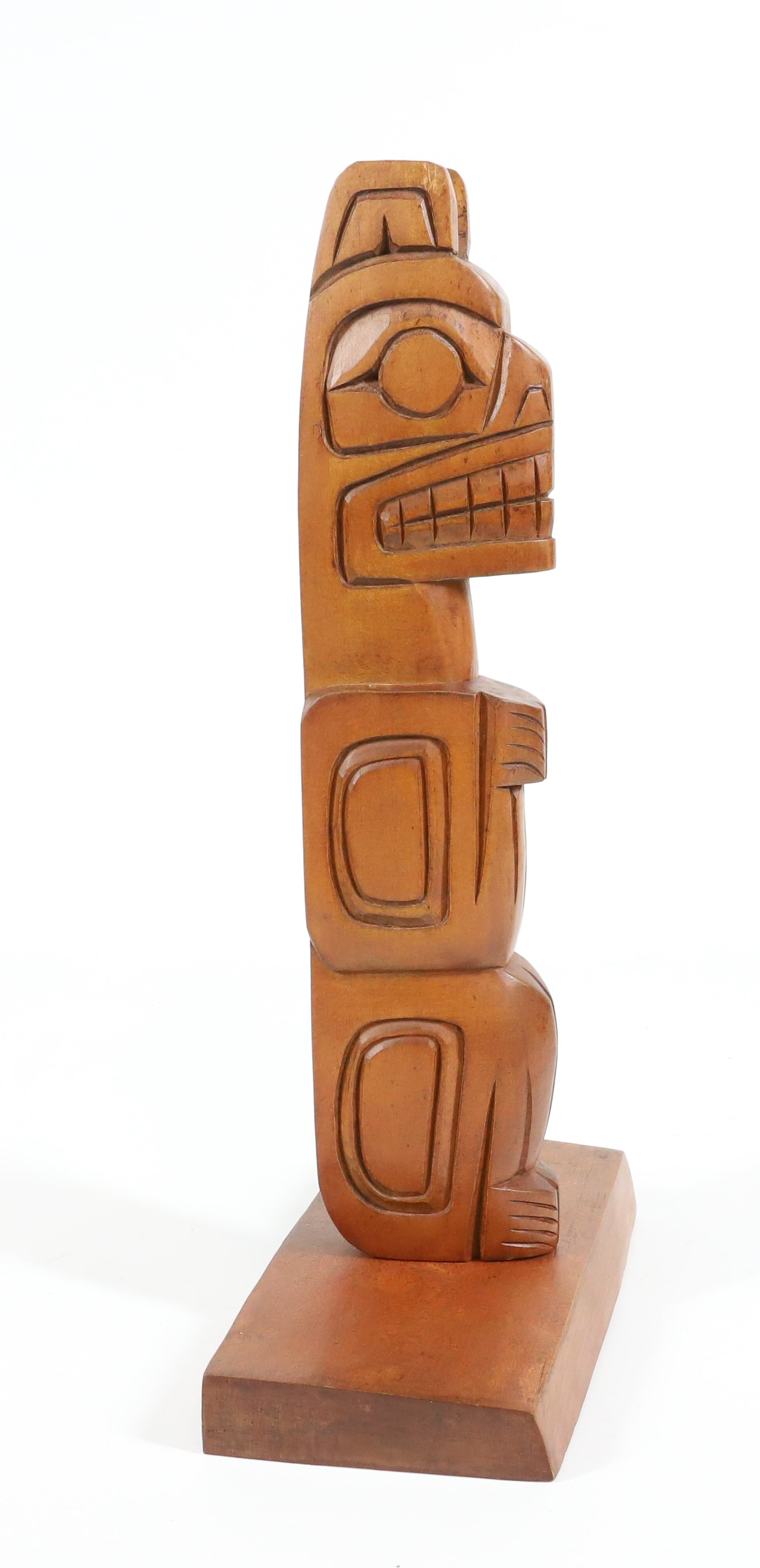 DARREN YELTON CARVED WOODEN TOTEM POLE: CARVED AND UNPAINTED. MRKD. ON BOTTOM "DARREN YELTON, SQUAMISH GRIZZLY BEAR, 1997"