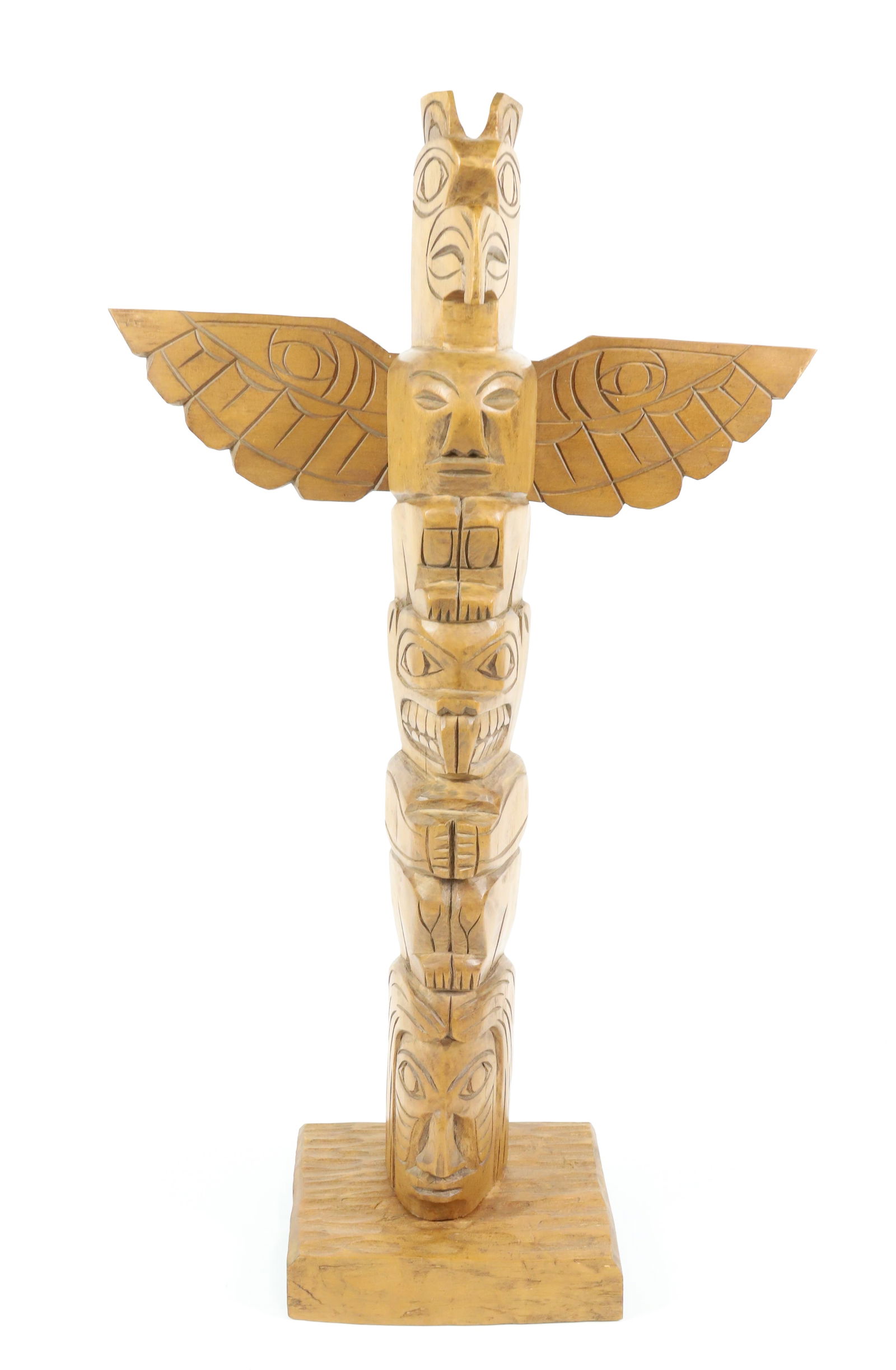 FRED BAKER CARVED TOTEM: CARVED AND SGND. ON BACK OF WING "CAPRANO RES. B.C., 1986". 22" X 13" WINGSPAN
