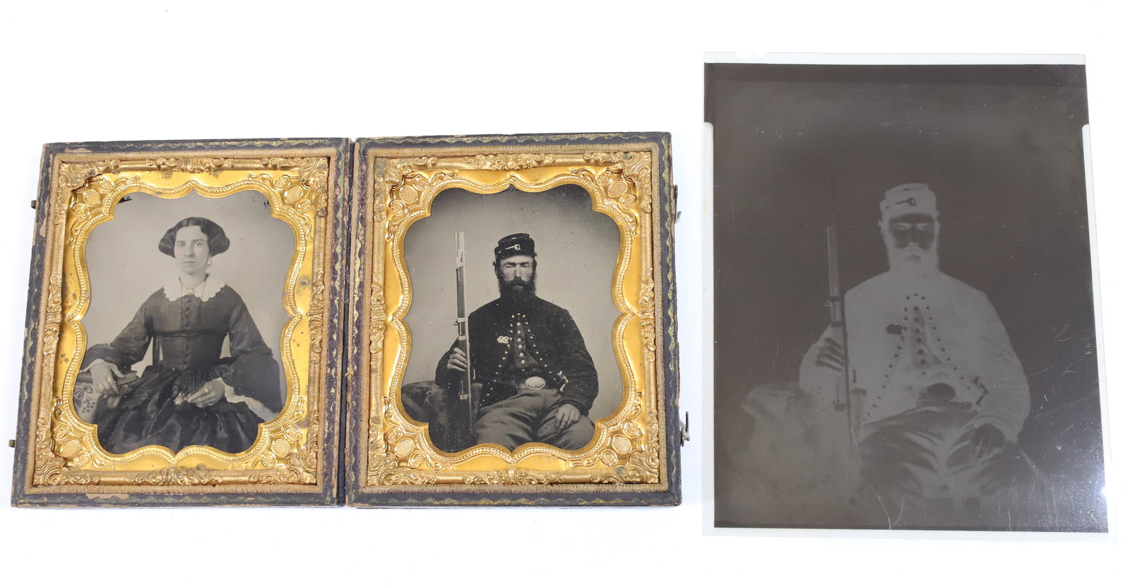 (2) CIVIL WAR AMBROTYPES OF SOLDIER AND WIFE: SIXTH PLATE AMBROTYPE OF SEATED SOLDIER (28TH GOLD STREAM AND 23RD BIRNEY ZOUAVES) HOLDING MUSKET IN ONE HAND AND BAYONET IN SCABBARD UNDER OTHER ARM. OVAL BUCKLE, GOLD BUTTONS AND PIN ON LAPEL. WIFE