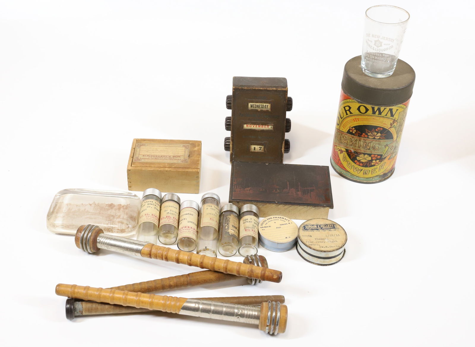 LOT OF PATERSON, NEW JERSEY ADVERTISING ITEMS: INCLUDING - BAKING POWDER TIN, CALENDAR, MEDICINE BOTTLES, SHOT GLASS, AND MORE PLEASE READ CAREFULLY - Terms for Purchasing and Shipping of Auction Items. Please read carefully before bidding. All pa