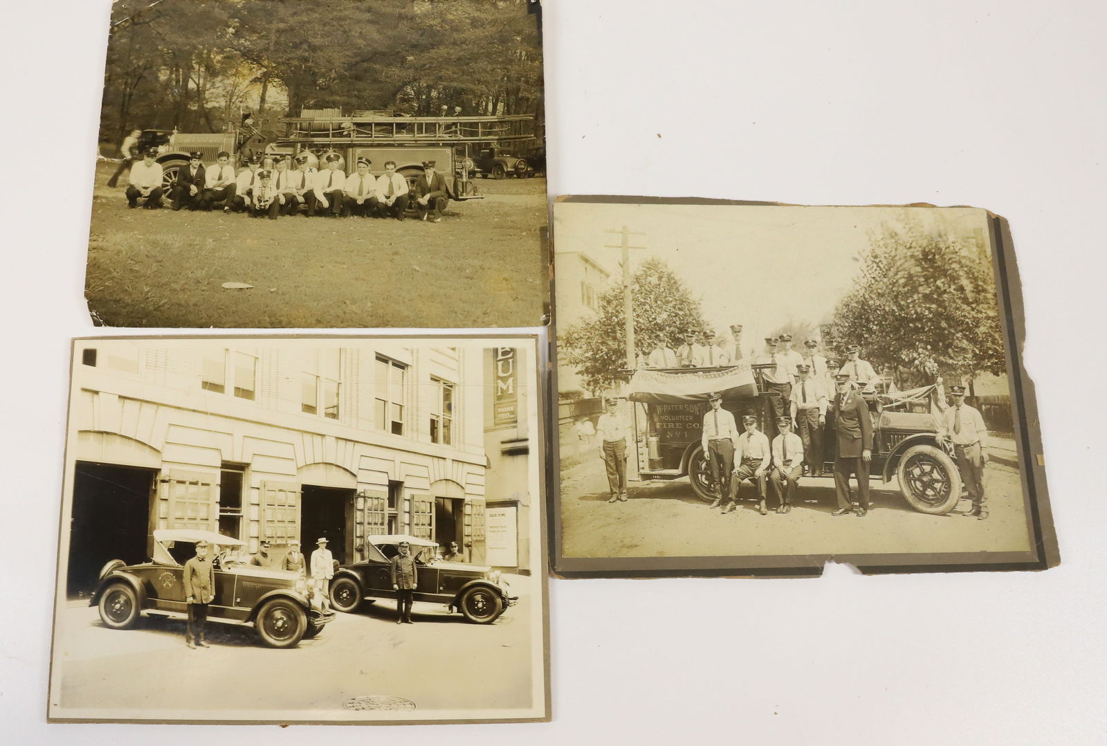 LOT OF FIREMEN PHOTOGRAPHS: (3) INCLUDING: PATERSON CARS IN FRONT OF STATION, 7 3/4" X 9 3/4", FIREMEN POSING IN FRONT OF NO. 1 TRUCK, WEST PATERSON AND MEN POSING ON "PARADE" TRUCK 7 1/2" X 9 3/4". PLEASE READ CAREFULLY - Terms