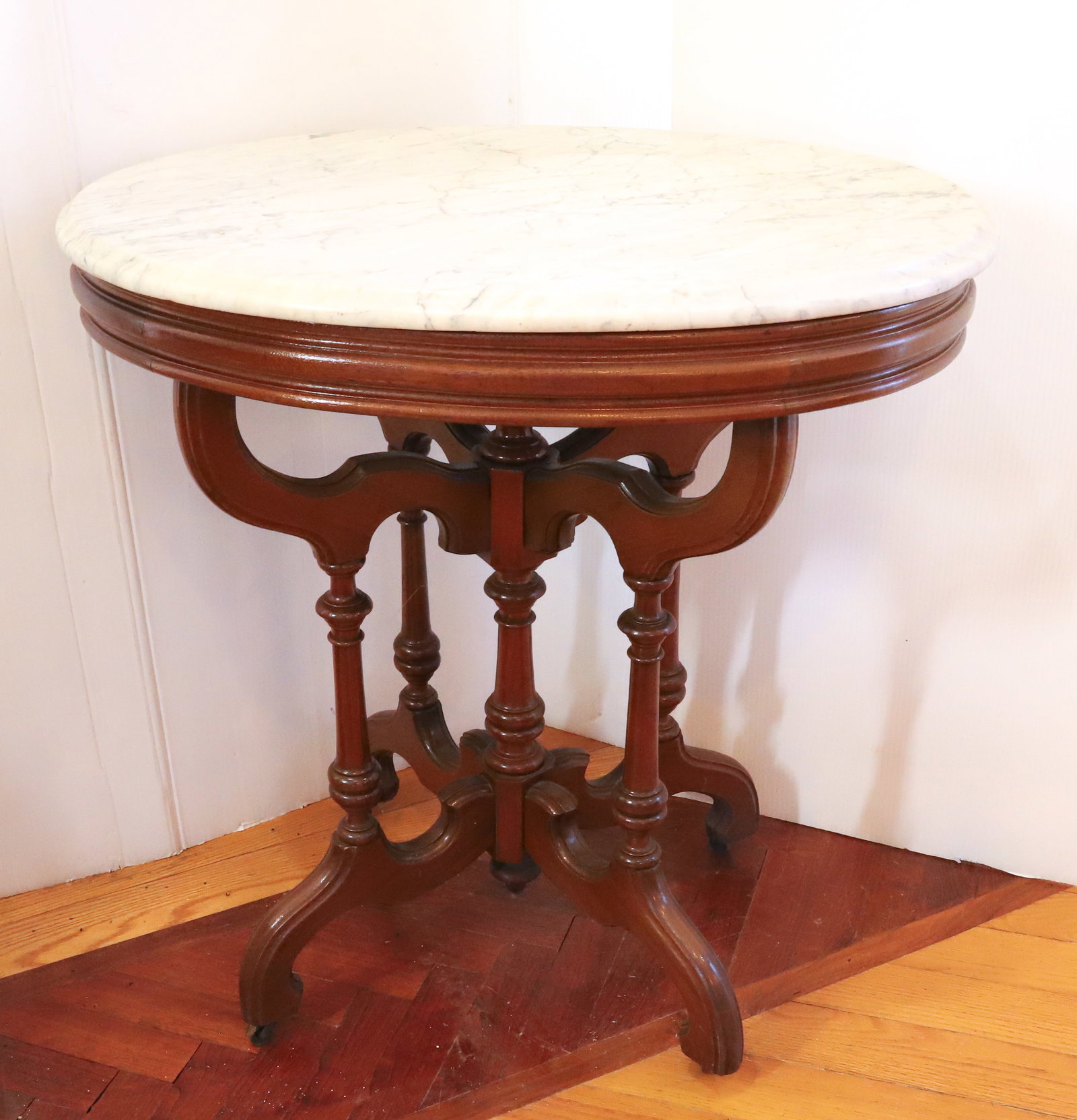 VICTORIAN MARBLE TOP TABLE: WALNUT OVAL MARBLE TOP PLEASE READ CAREFULLY - Terms for Purchasing and Shipping of Auction Items. Please read carefully before bidding. All payments for purchases will be made through LiveAuctioneers