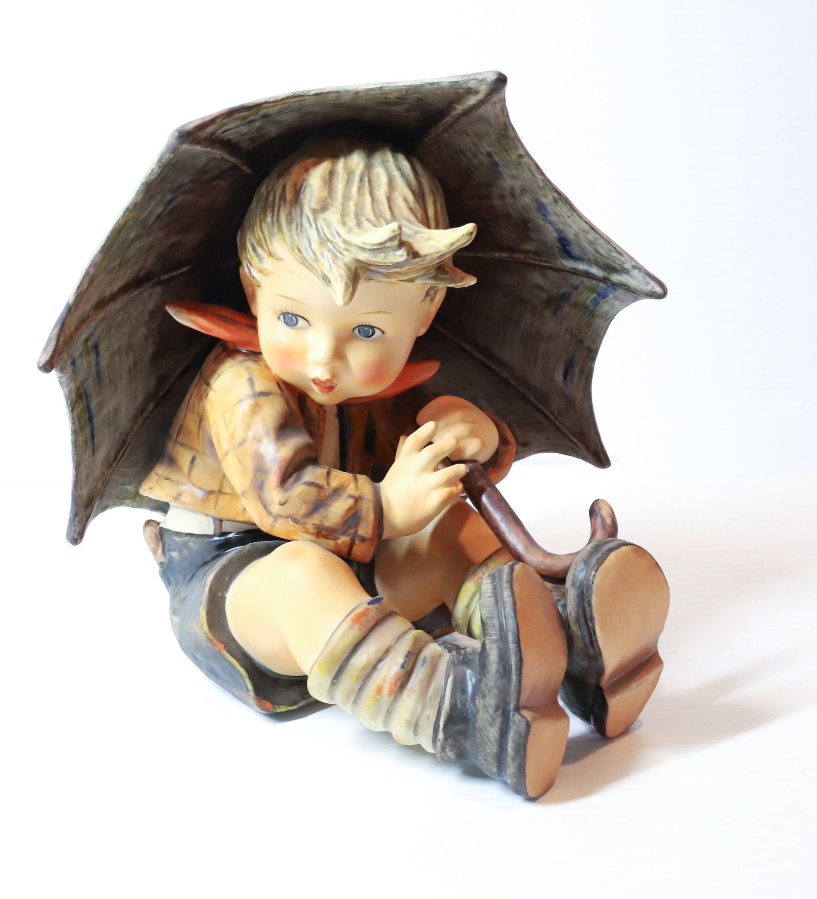 HUMMEL FIGURINE: UMBRELLA BOY, 152/ II/ A (TNK-5) 7 1/2" H PLEASE READ CAREFULLY - Terms for Purchasing and Shipping of Auction Items. Please read carefully before bidding. All payments for purchases will be made thro