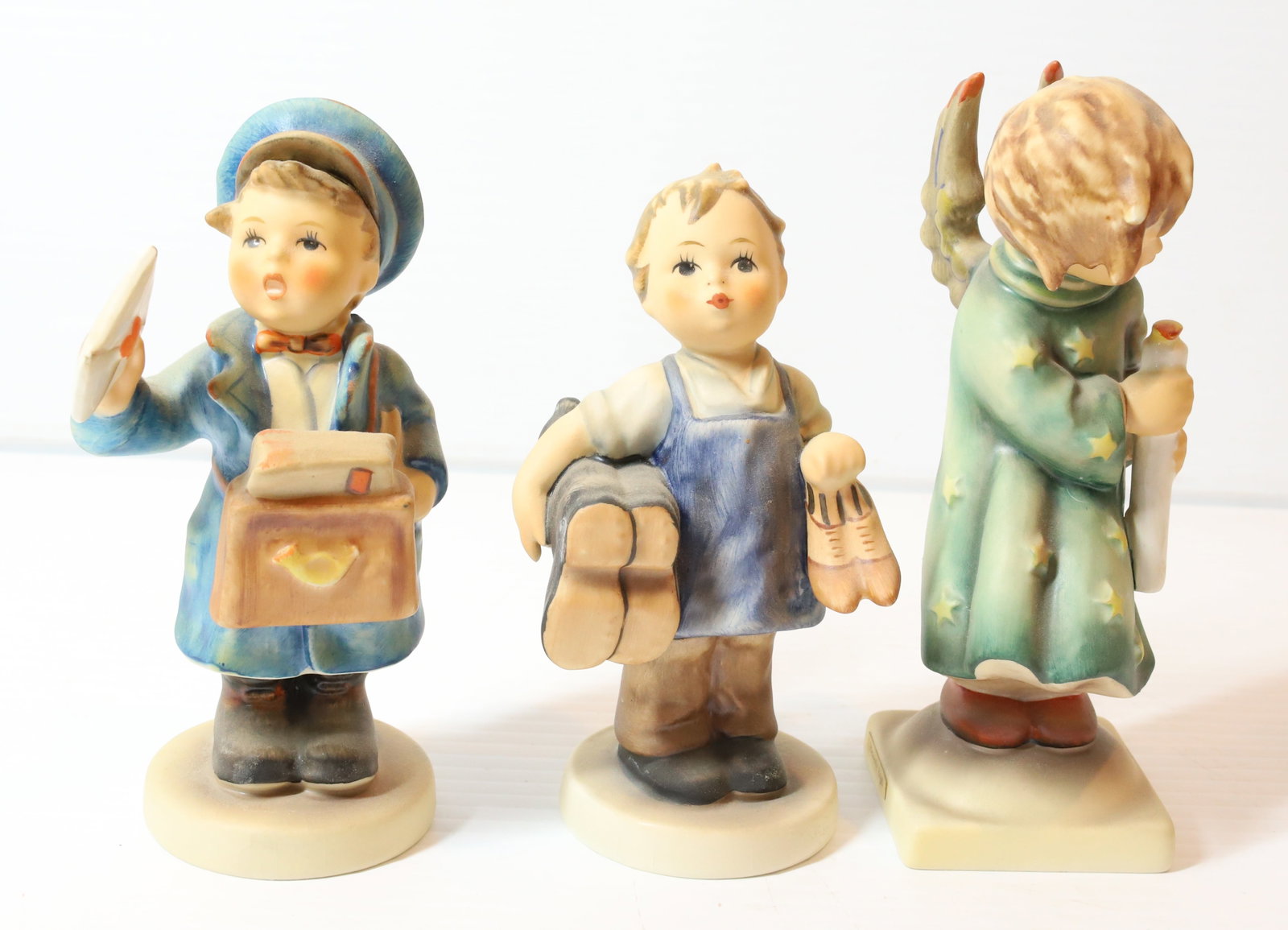HUMMEL FIGURINE: HEAVENLY ANGEL 6"H, POSTMAN AND BOOTS. TMK-3 MARKS PLEASE READ CAREFULLY - Terms for Purchasing and Shipping of Auction Items. Please read carefully before bidding. All payments for purchases will be 