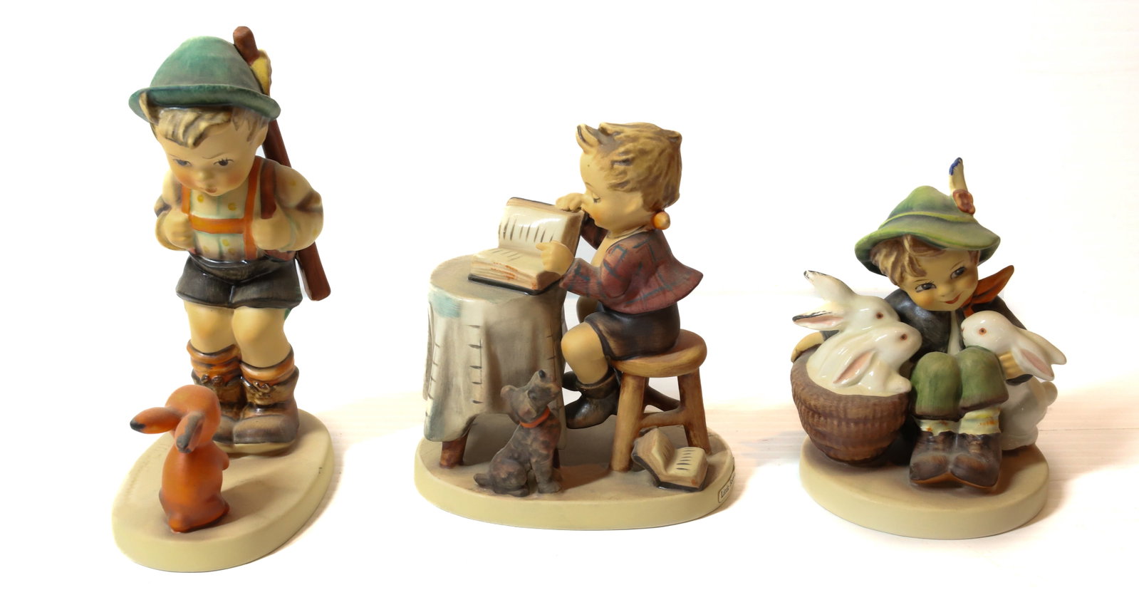HUMMEL FIGURINE: SENSITIVE HUNTER 6"H, LITTLE BOOK KEEPER AND PLAYMATES. TMK-5 MARKS PLEASE READ CAREFULLY - Terms for Purchasing and Shipping of Auction Items. Please read carefully before bidding. All payments for p