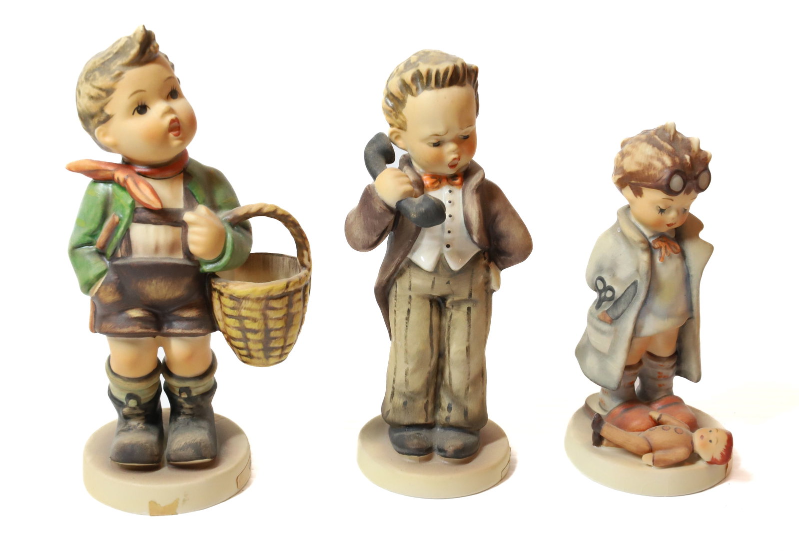 HUMMEL FIGURINES: VILLAGE BOY 6"H, DOCTOR AND HELLO. TMK-5 MARKS PLEASE READ CAREFULLY - Terms for Purchasing and Shipping of Auction Items. Please read carefully before bidding. All payments for purchases will be made