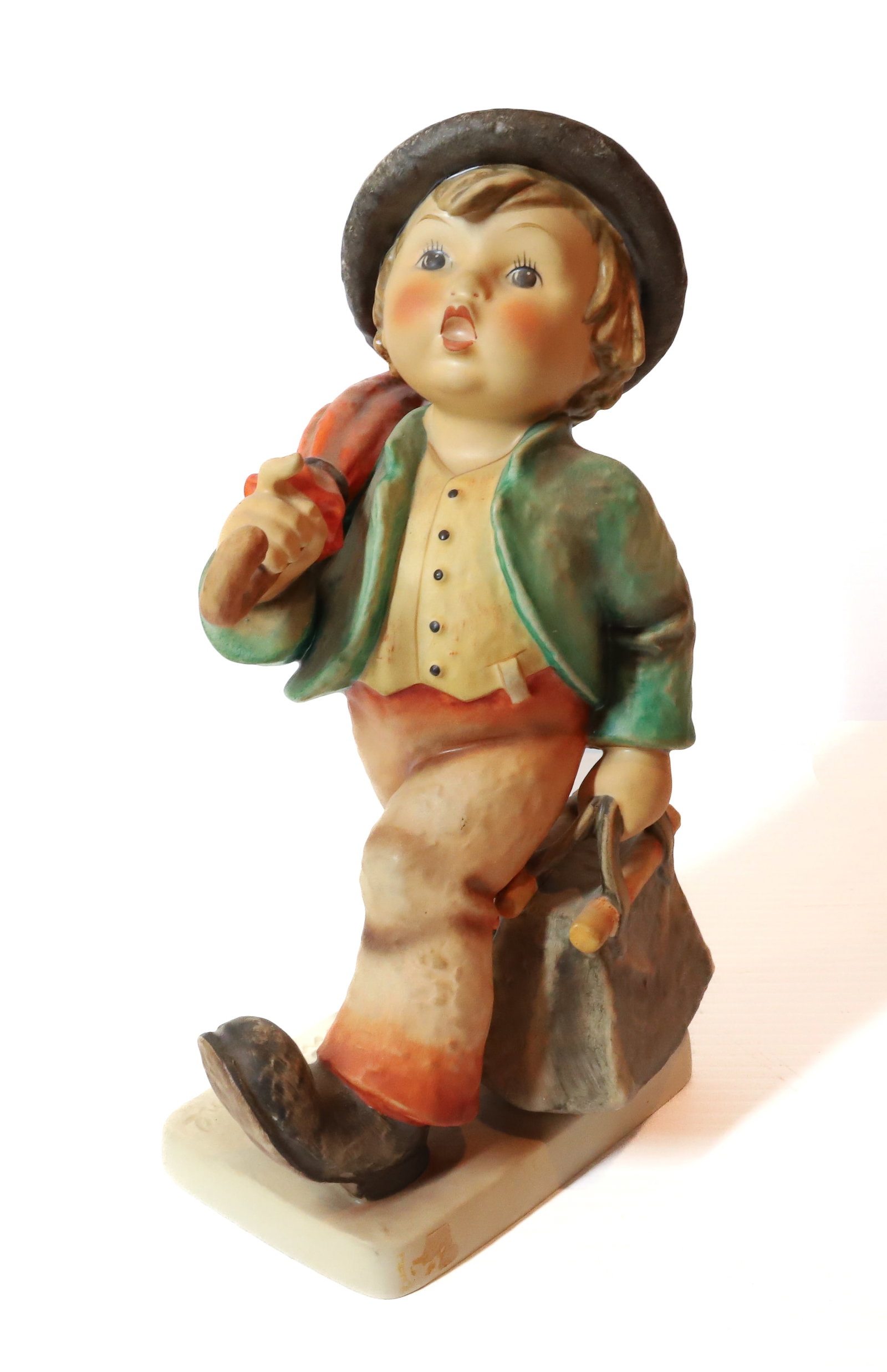 HUMMEL FIGURINE: MERRY WANDERER, 10" H TMK-5 MARK PLEASE READ CAREFULLY - Terms for Purchasing and Shipping of Auction Items. Please read carefully before bidding. All payments for purchases will be made through LiveA