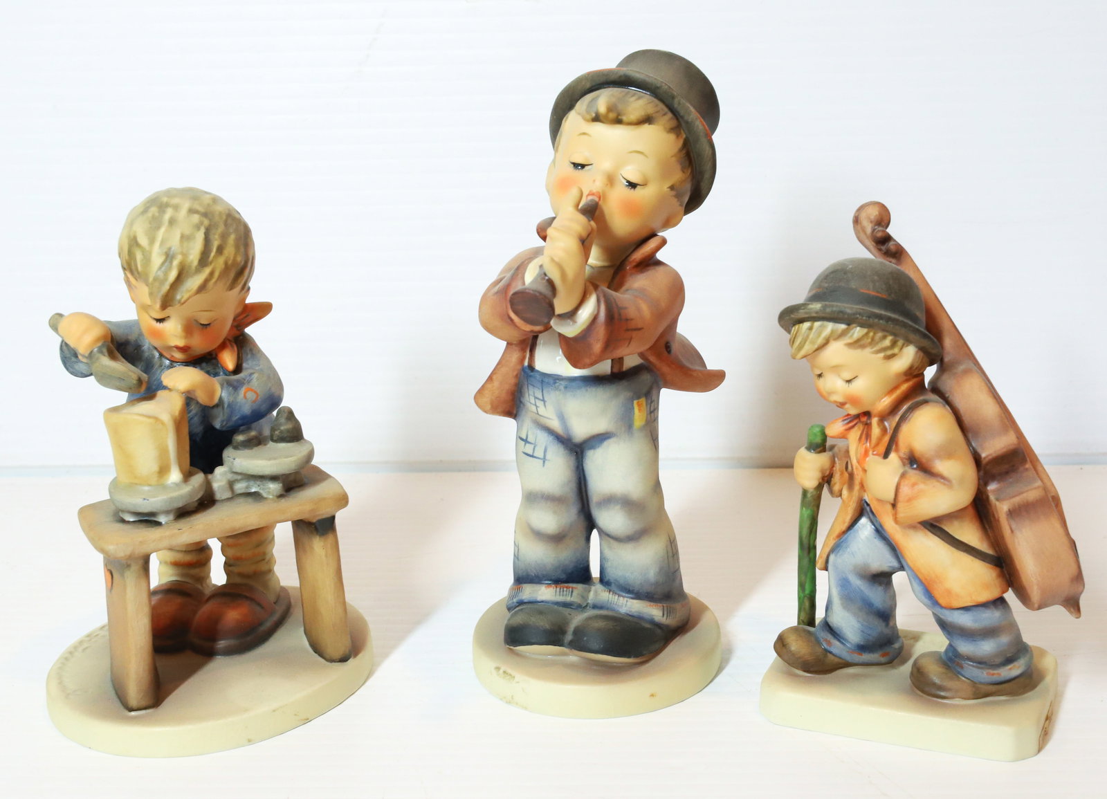 HUMMEL FIGURINES: SERENADE 6 1/2" H, A FAIR MEASURE AND LITTLE CELLIST. TMK-5 MARKS PLEASE READ CAREFULLY - Terms for Purchasing and Shipping of Auction Items. Please read carefully before bidding. All payments for pur