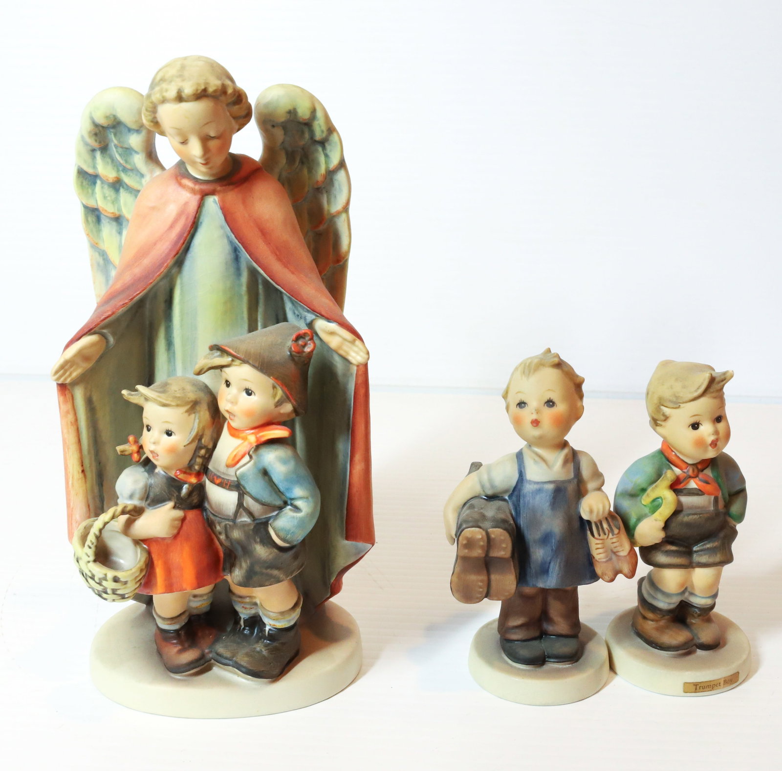 HUMMEL FIGURINES: HEAVENLY PROTECTION 88/II 8 1/4" H, TRUMPET BOY AND BOOTS. TMK-3 MARKS PLEASE READ CAREFULLY - Terms for Purchasing and Shipping of Auction Items. Please read carefully before bidding. All payments fo